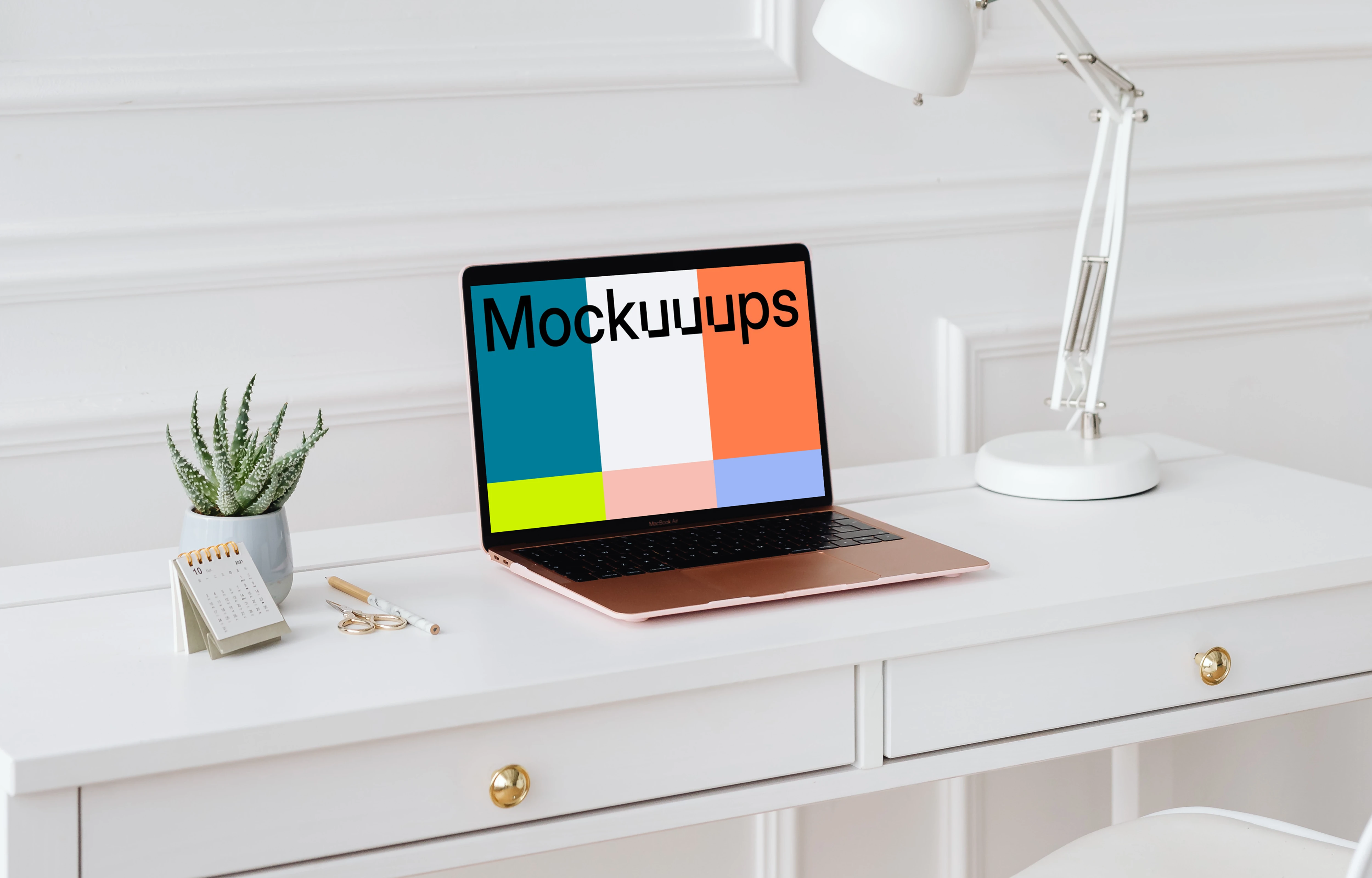 MacBook Air mockup on a desk beside a potted plant