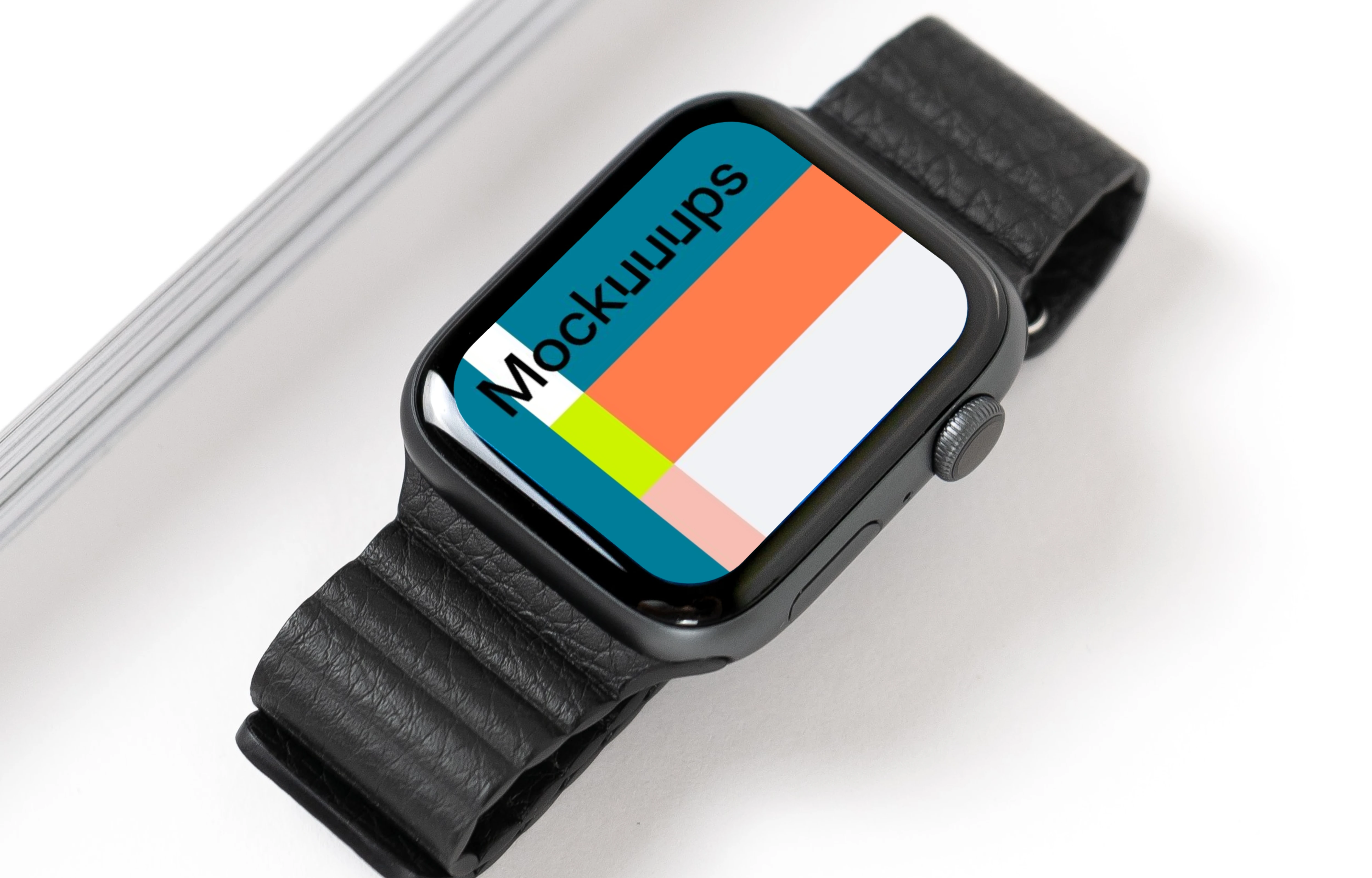 Apple Watch mockup on table beside a book