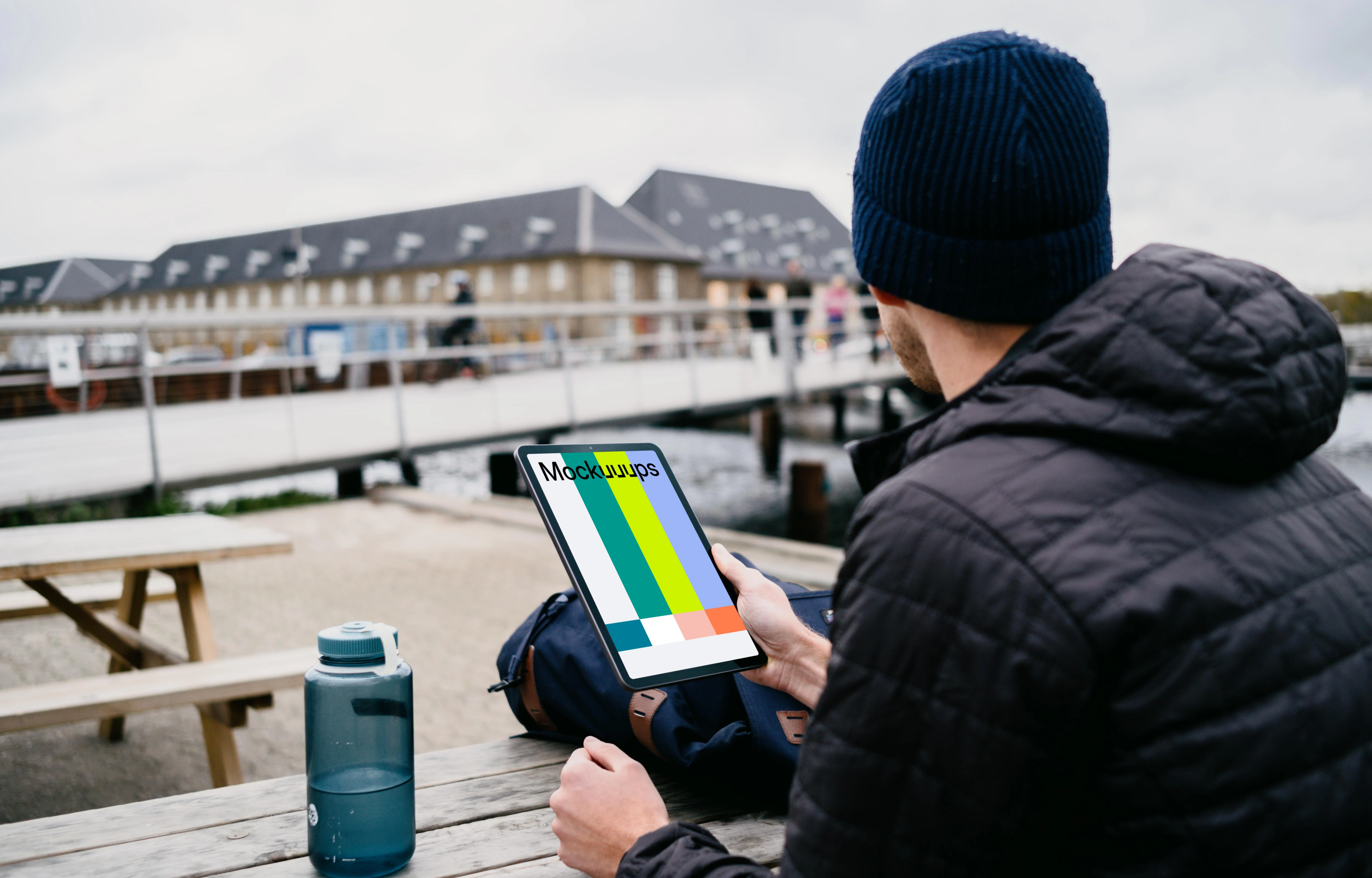  iPad Air mockup held by a user’s hand outside