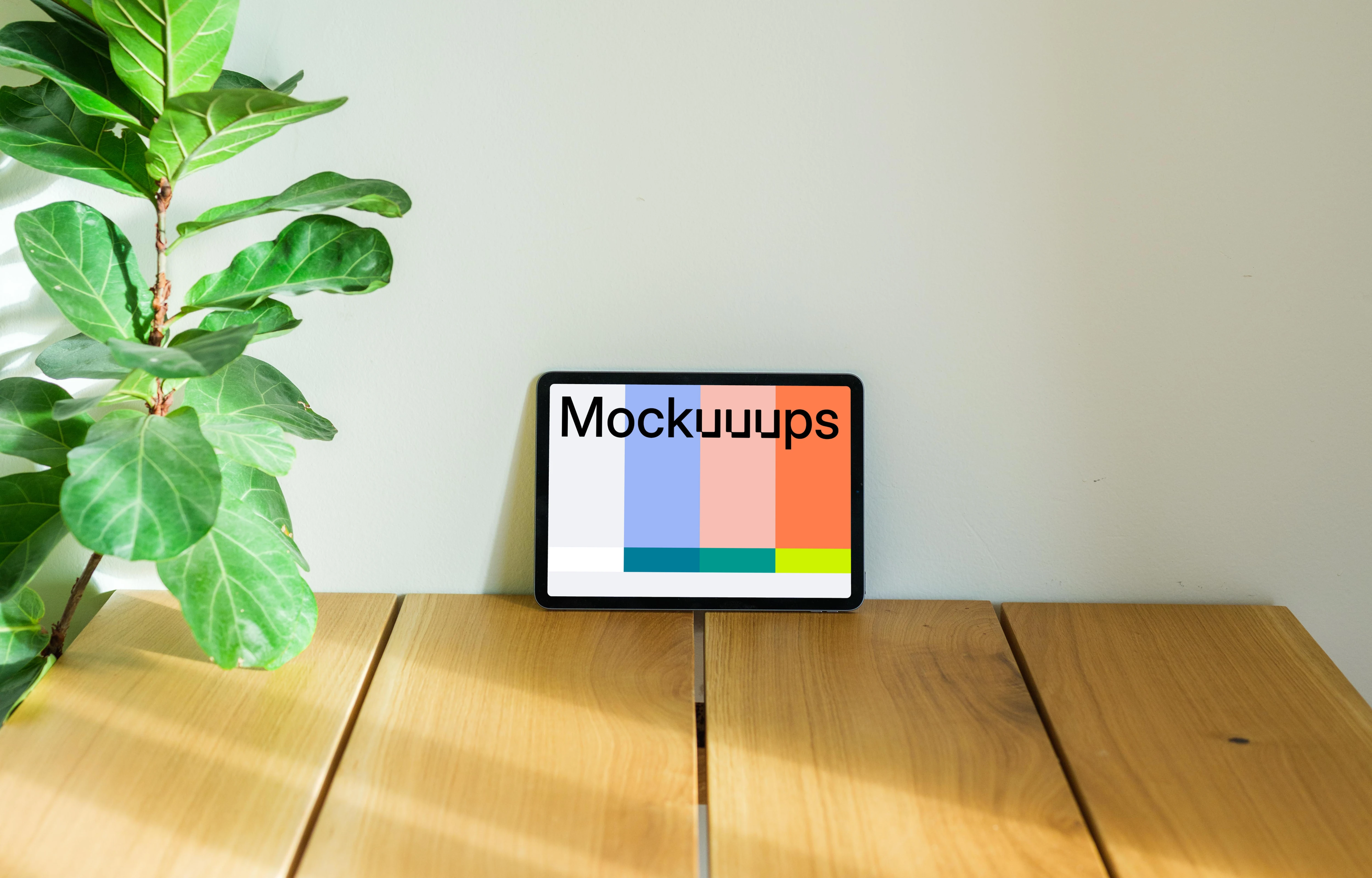 iPad Air mockup on a table leaning against a wall