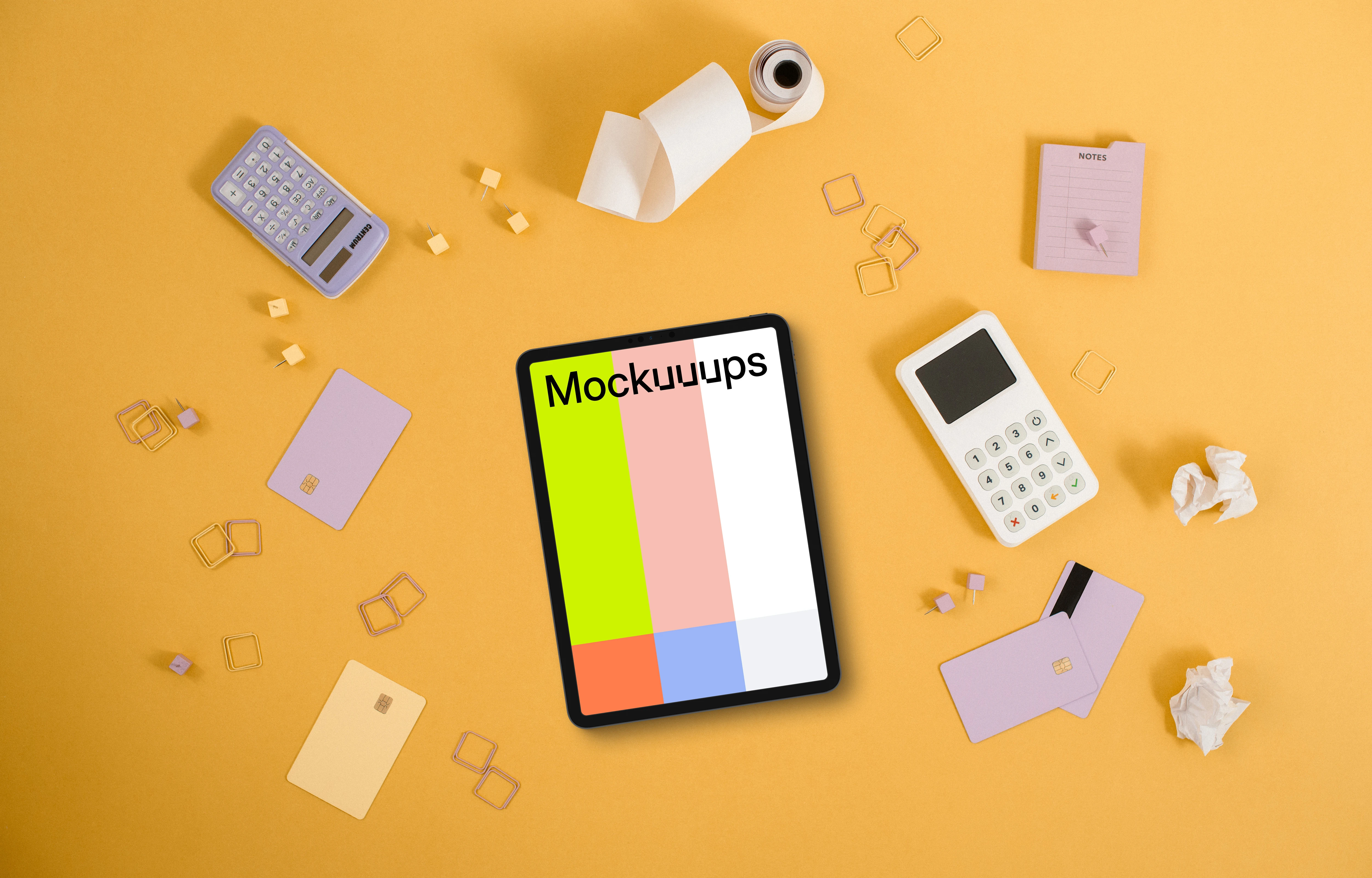 iPad mockup surrounded by credit cards on yellow background