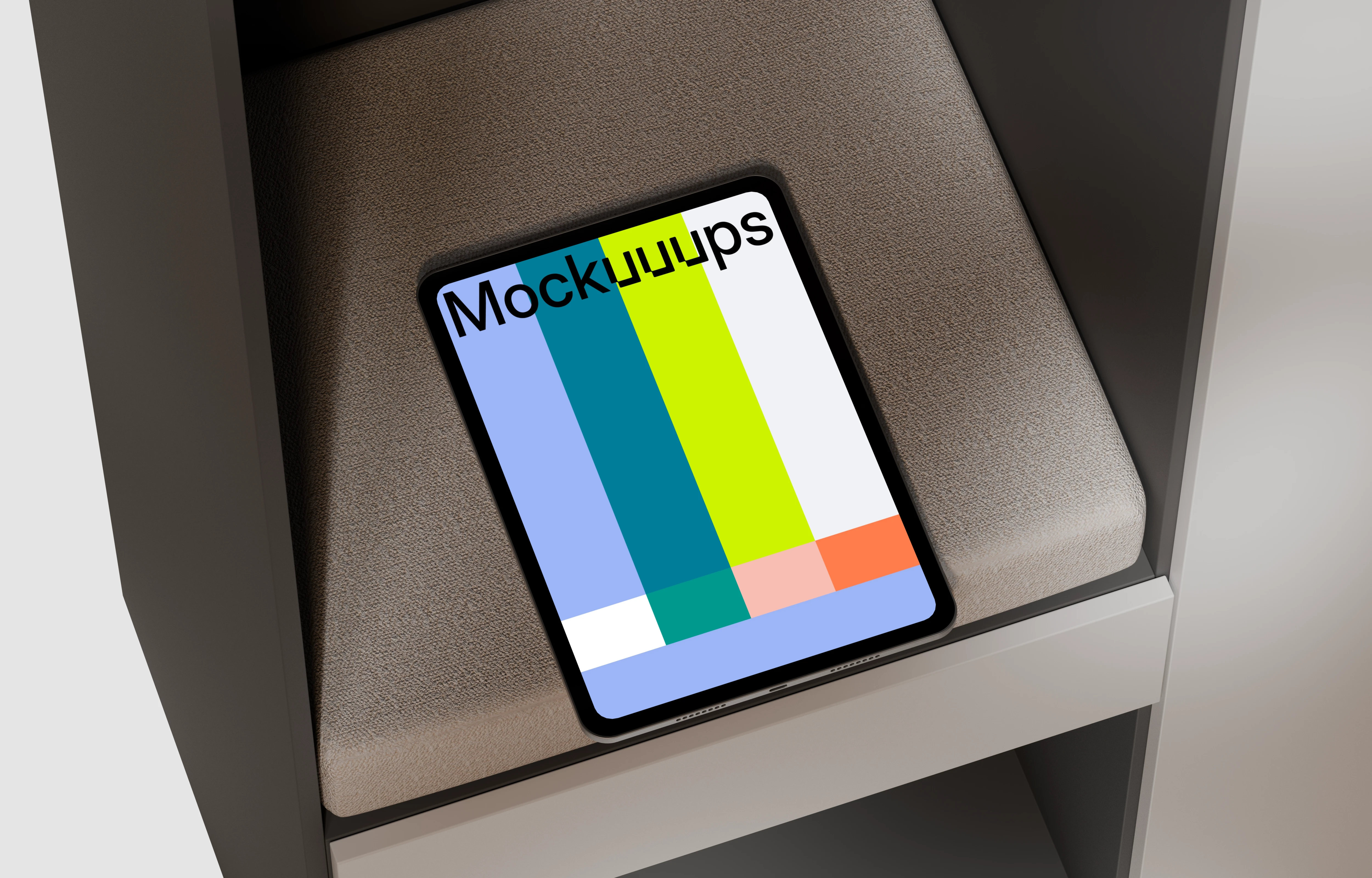 iPad Pro mockup on a textured cushion in a modern shelf