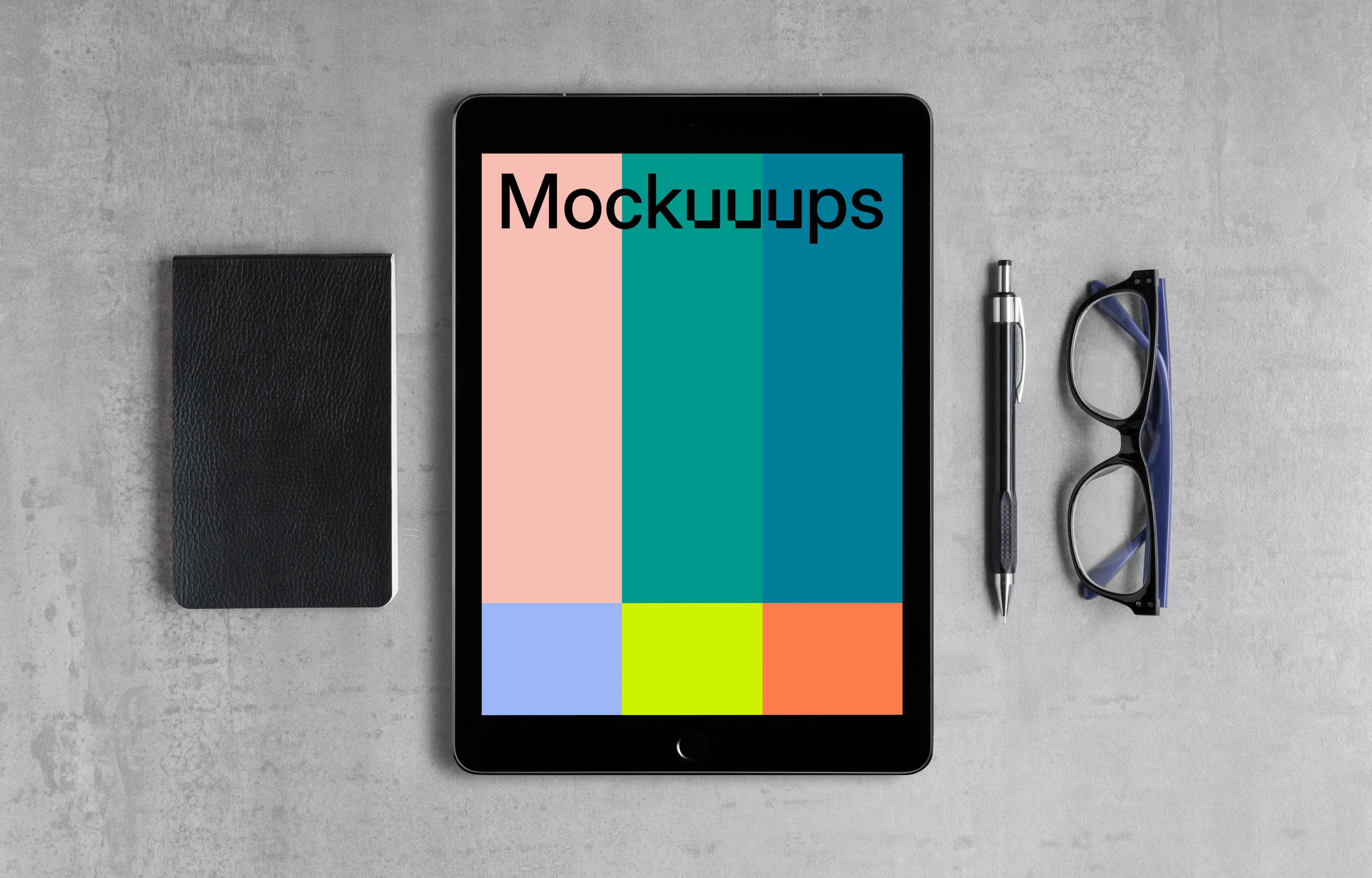 iPad Pro mockup with a journal on the side