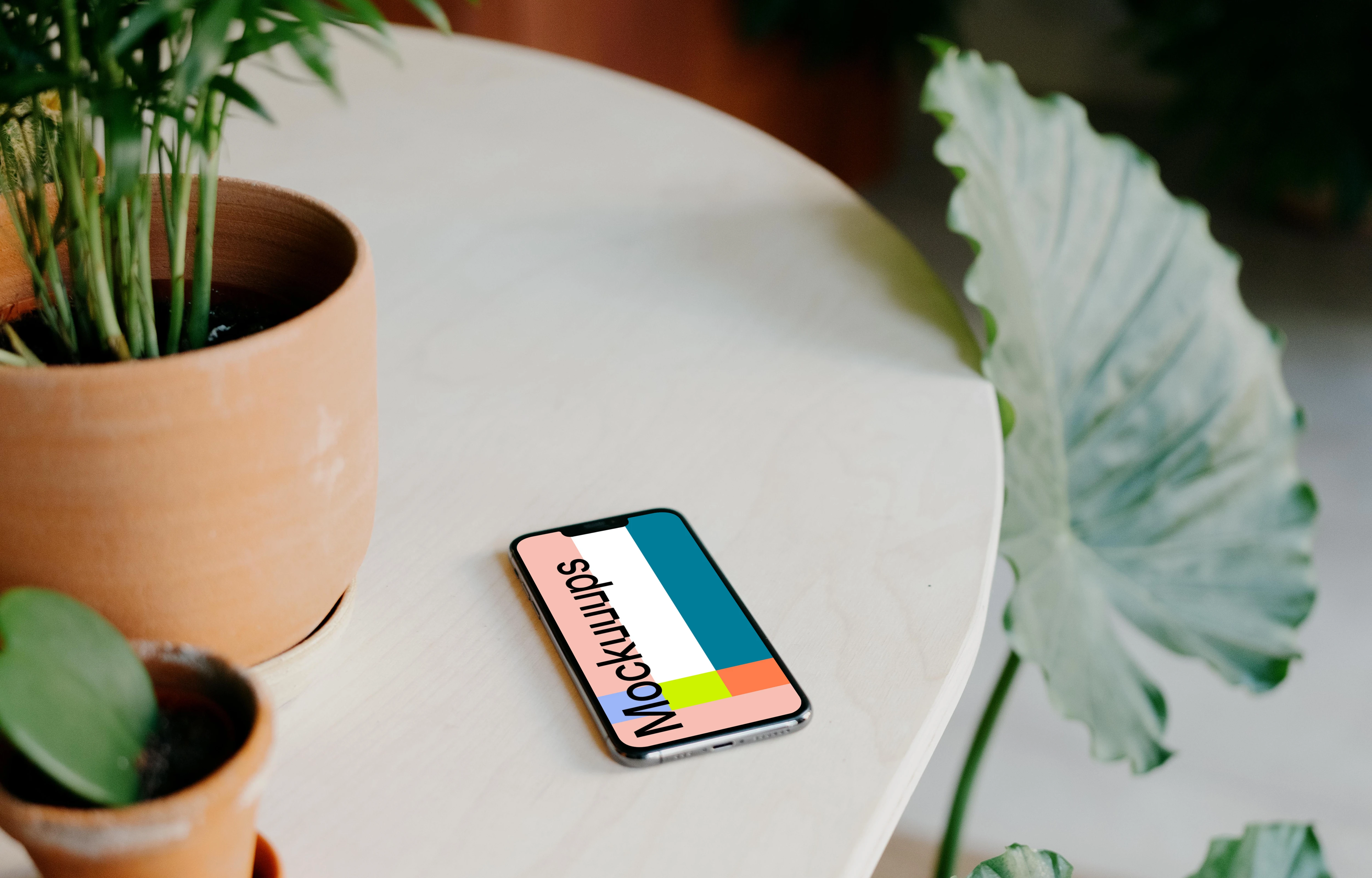 iPhone 13 Pro mockup on a white table 