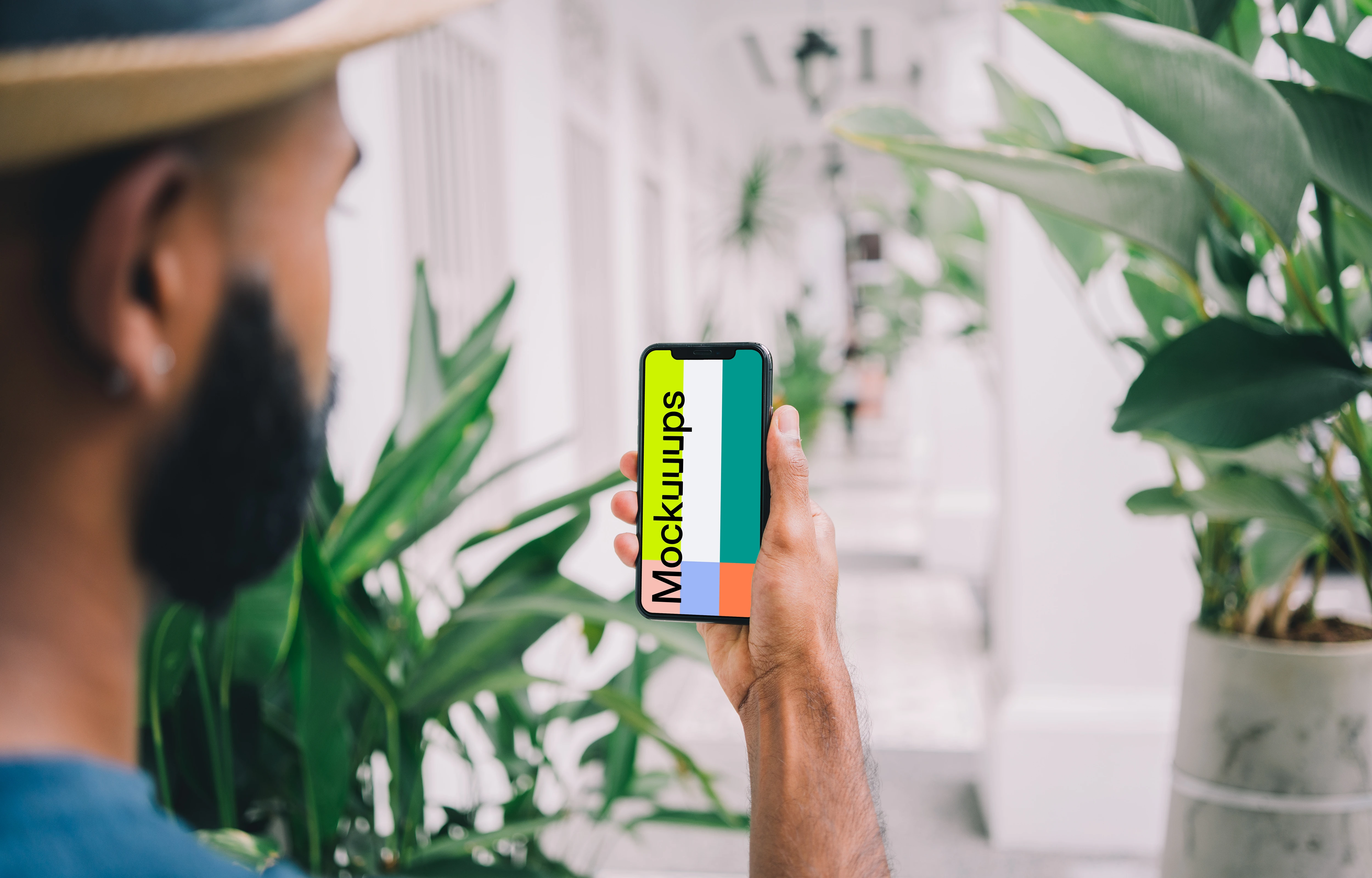 iPhone mockup held in selfie position