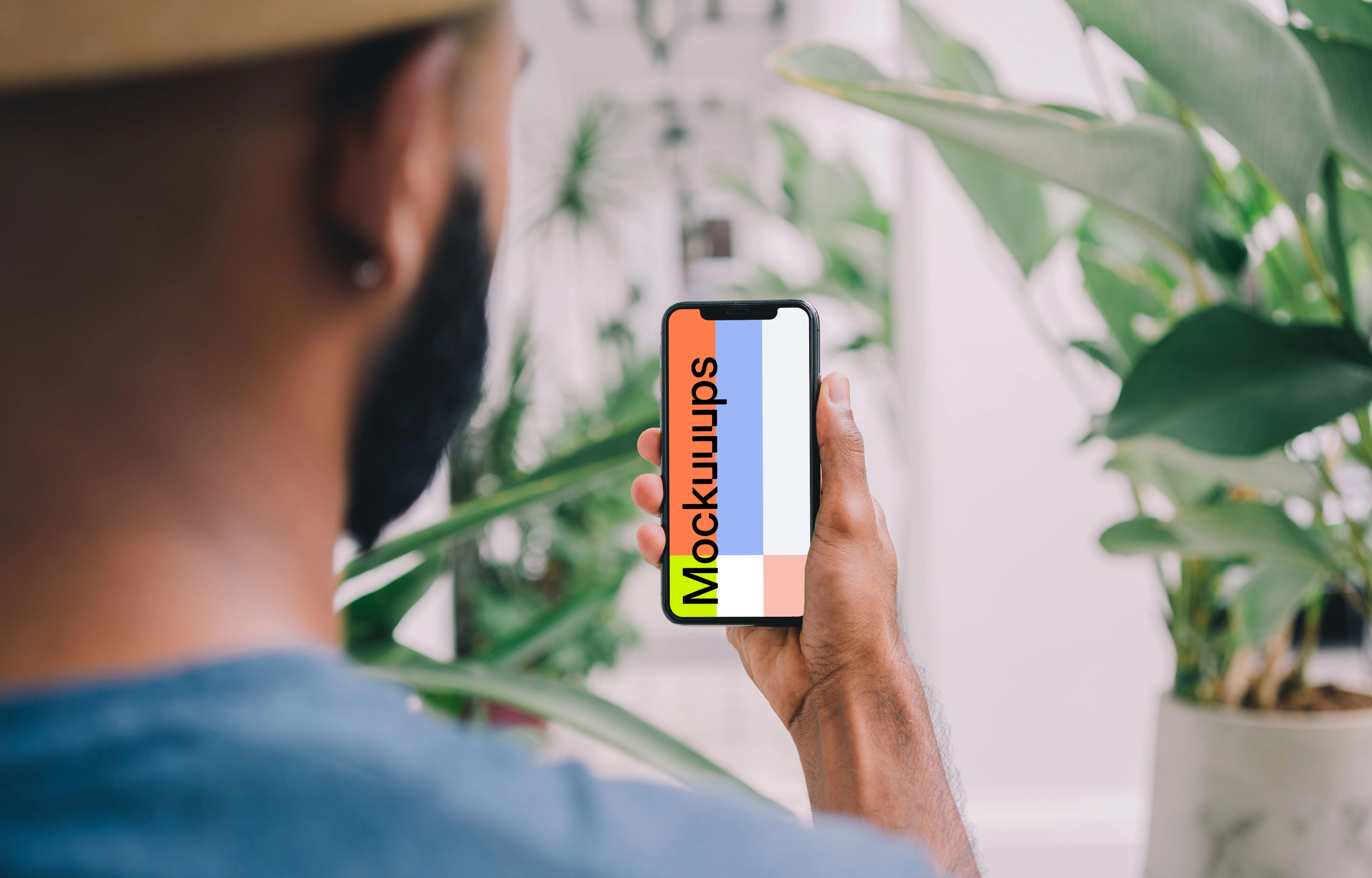 iPhone mockup with flowers in the background