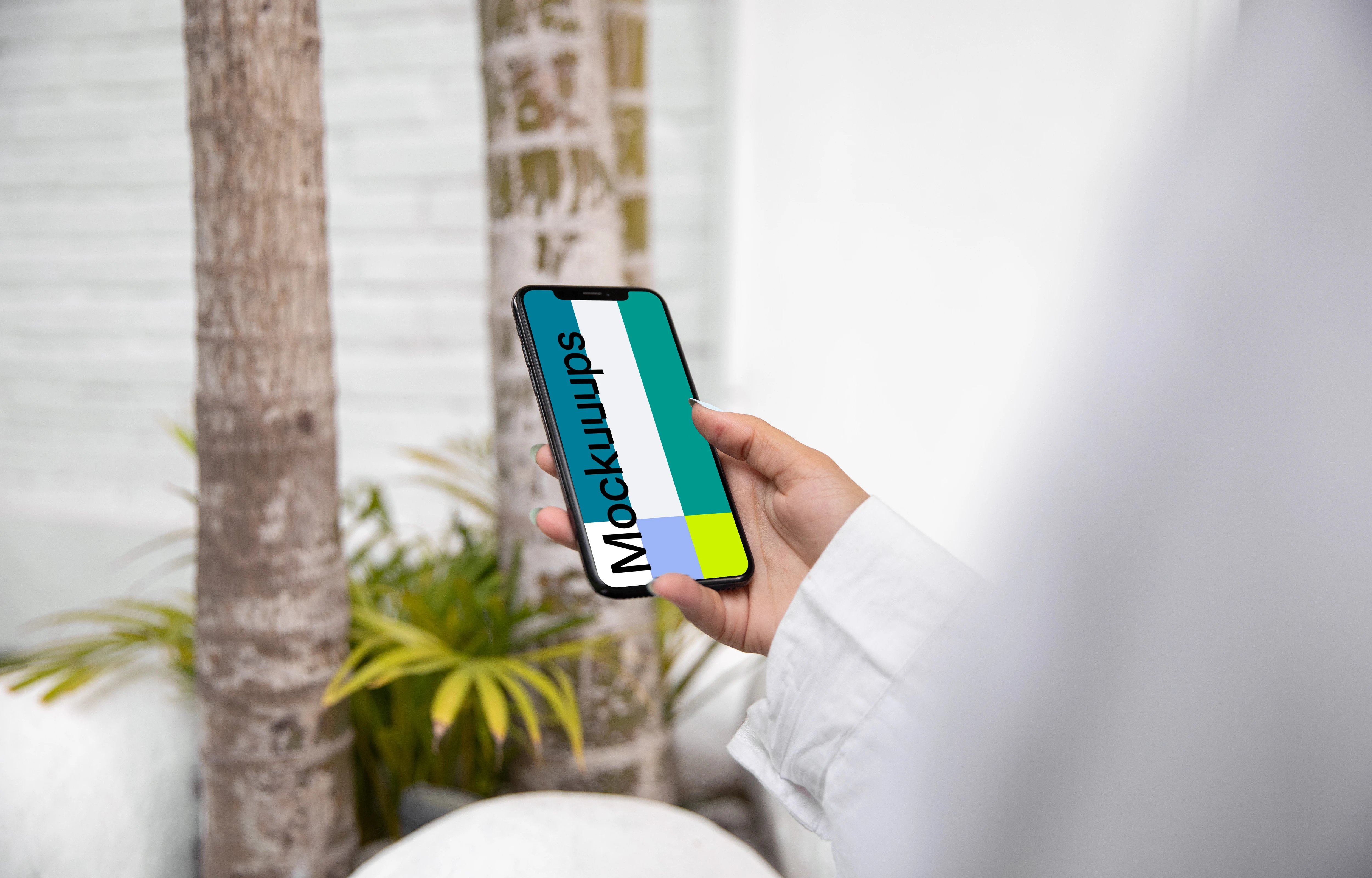 iPhone X mockup in a user’s hand