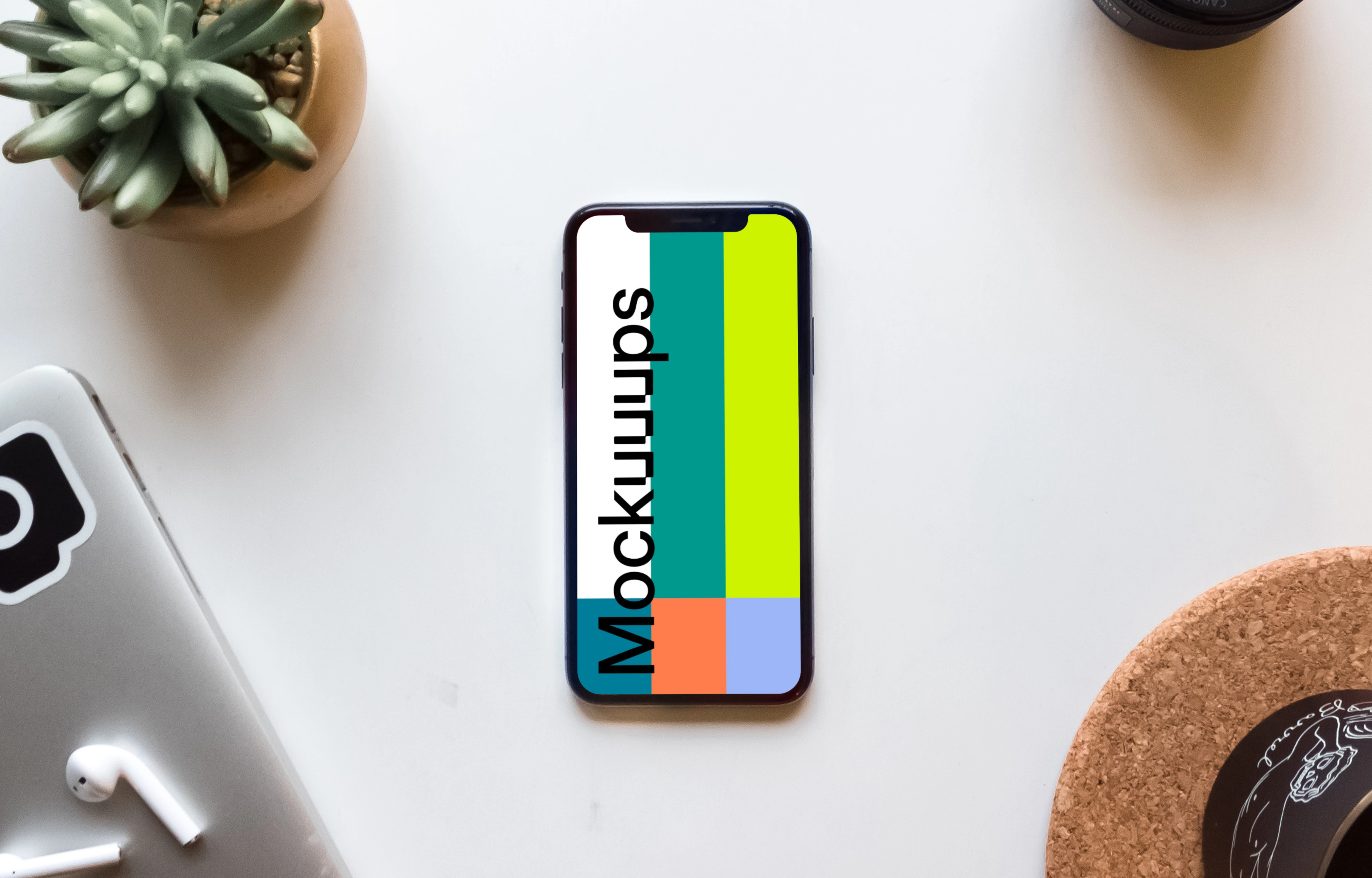 iPhone X Space Gray mockup on white table