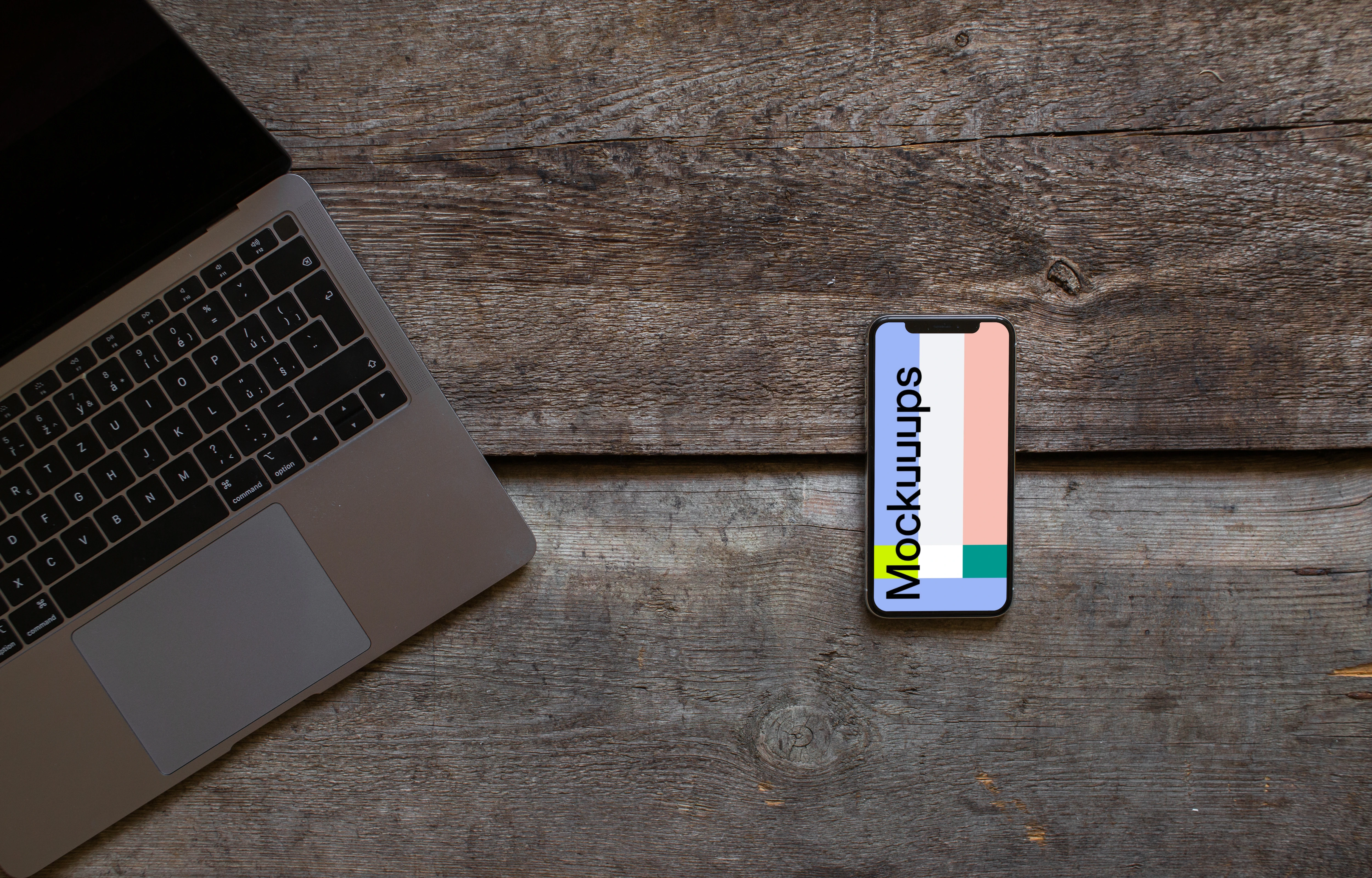 iPhone XS mockup and cropped Macbook Air on the wooden table