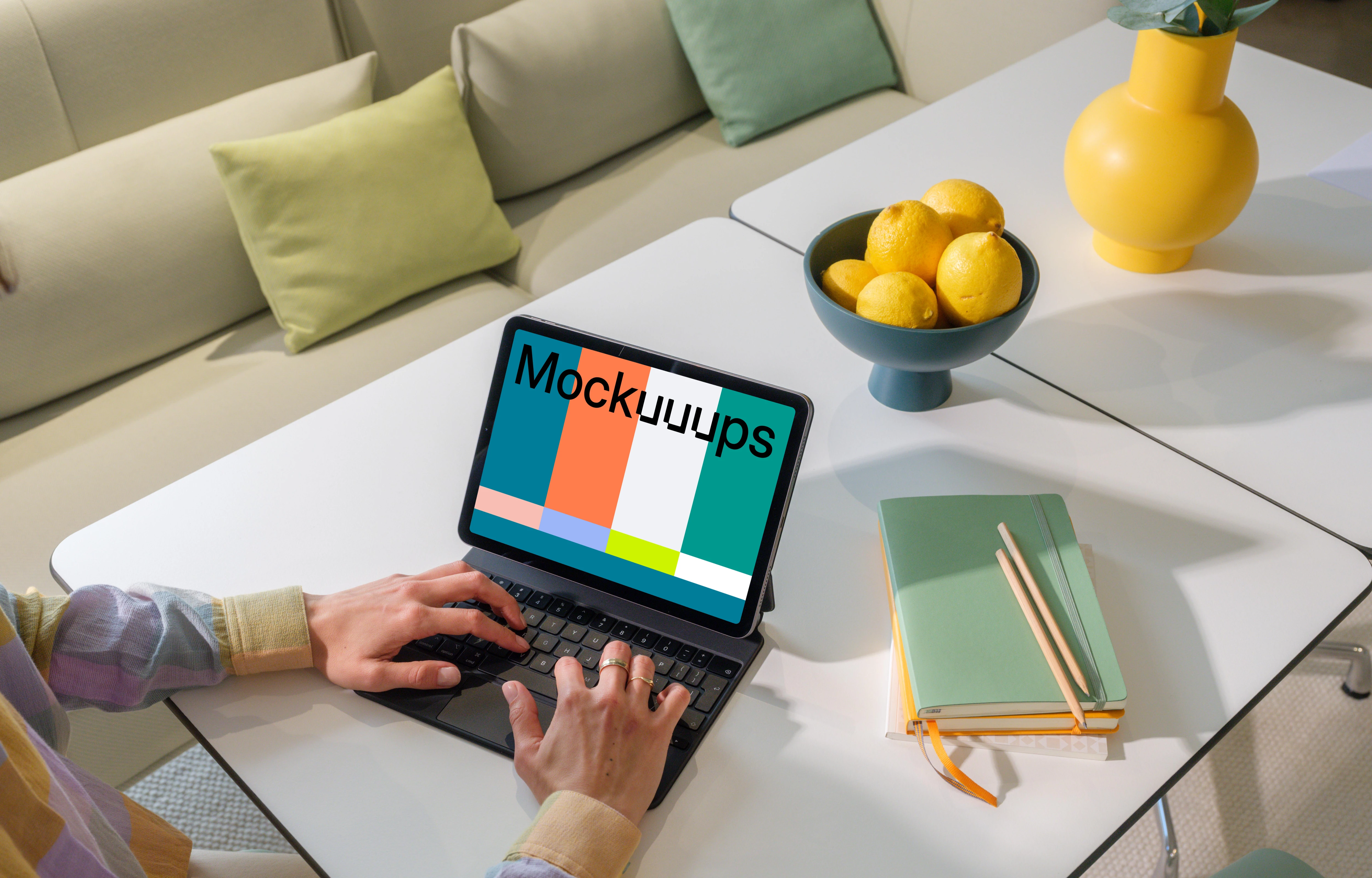iPad Air mockup with woman's hands on home office desk