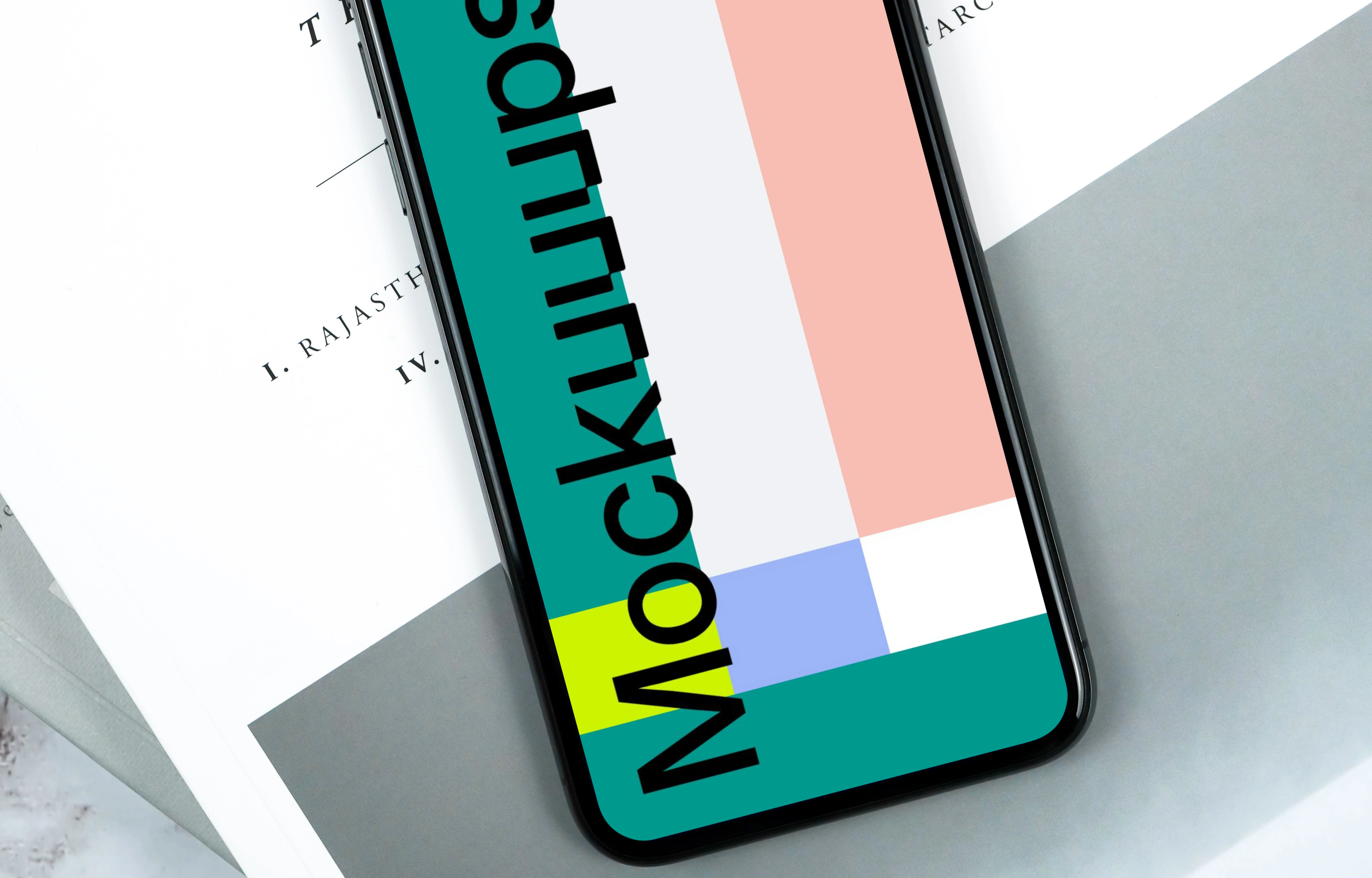 Light scene with iPhone XS mockup and magazine