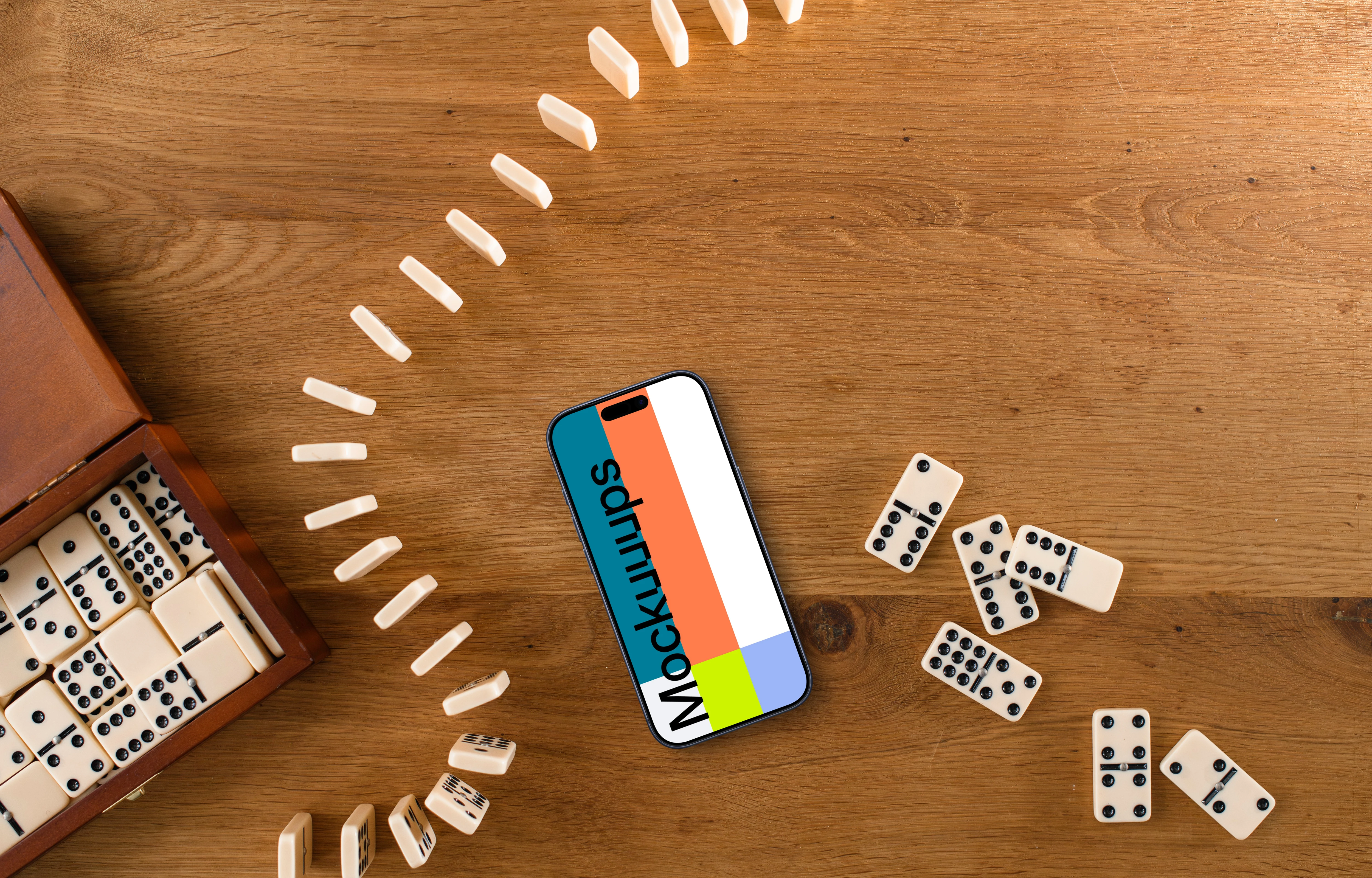 iPhone mockup in the middle of dominoes