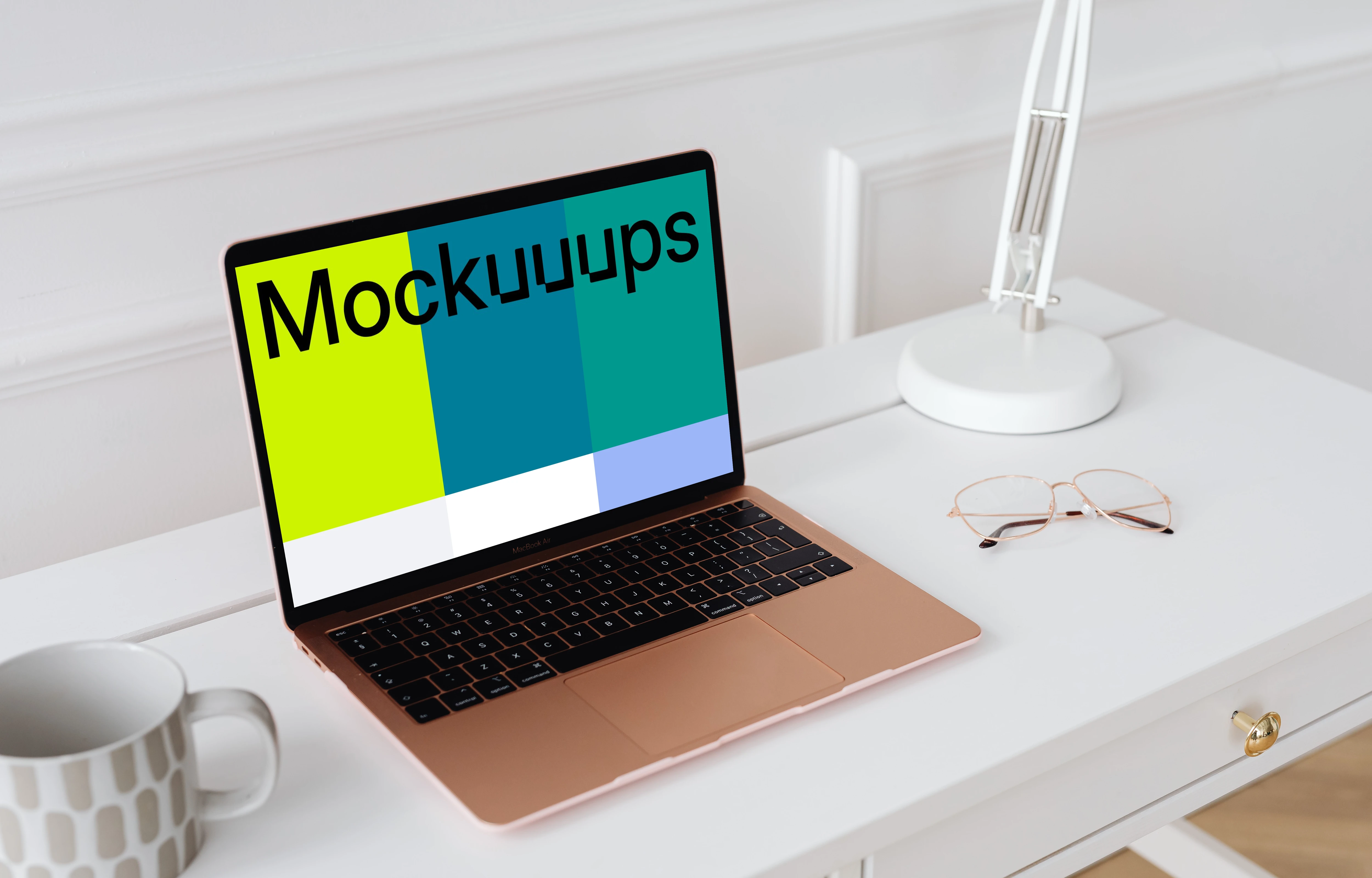 MacBook Air mockup on a table with a coffee mug at the side