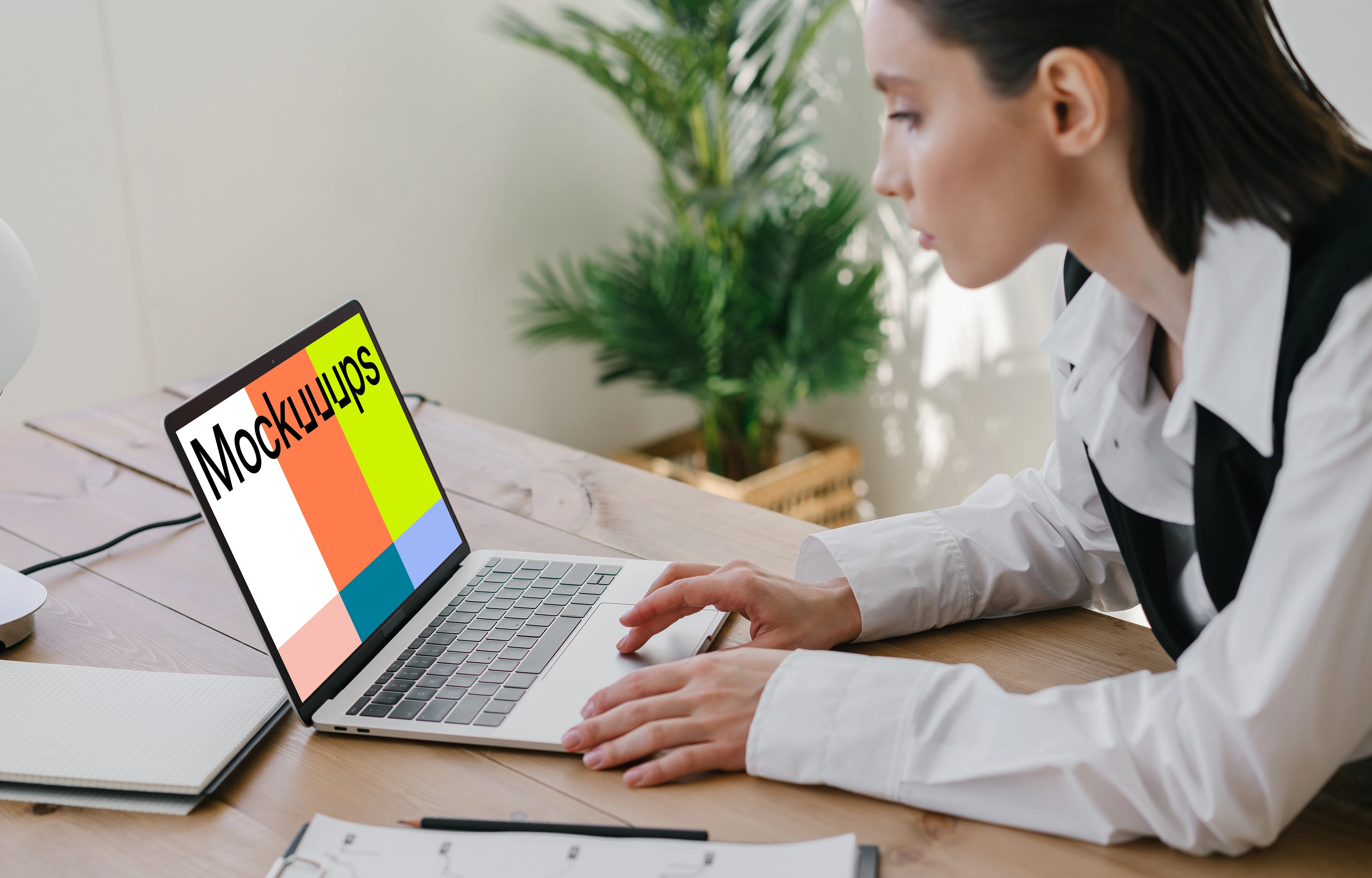 MacBook Air Mockup used by a corporately dressed lady 
