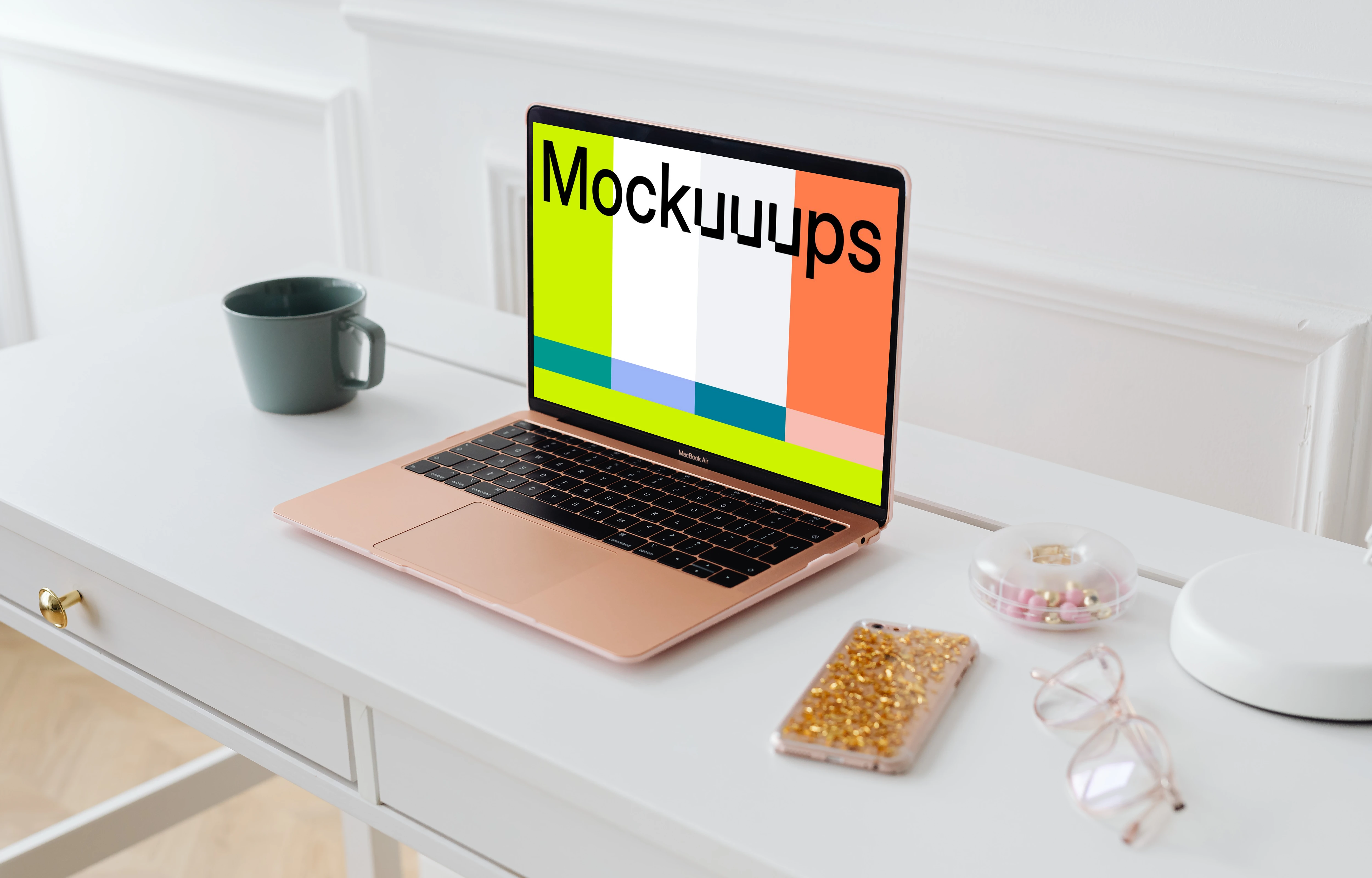 MacBook Air mockup with an iPhone at the side