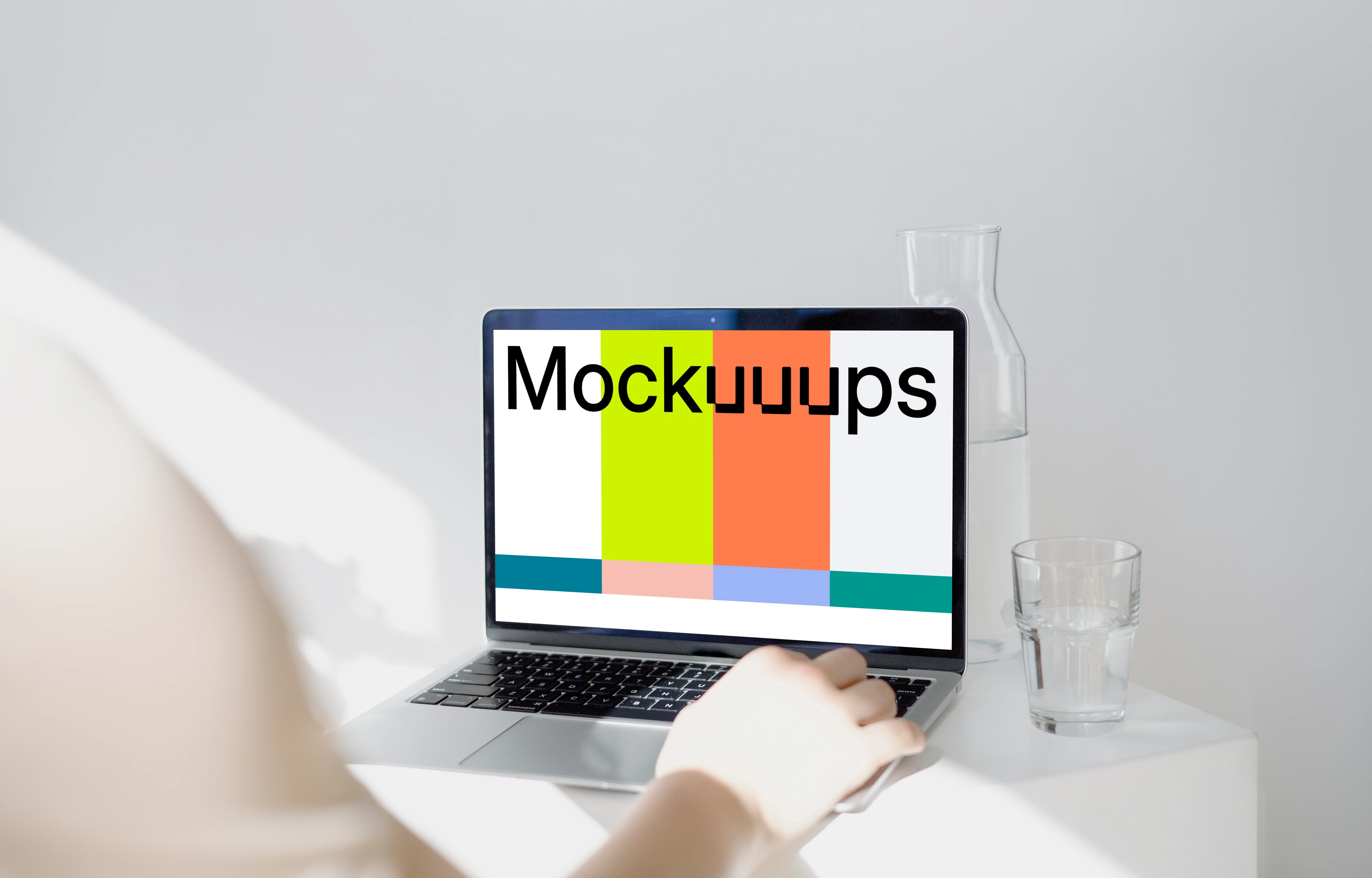 MacBook Pro mockup before a glass jar and tumbler