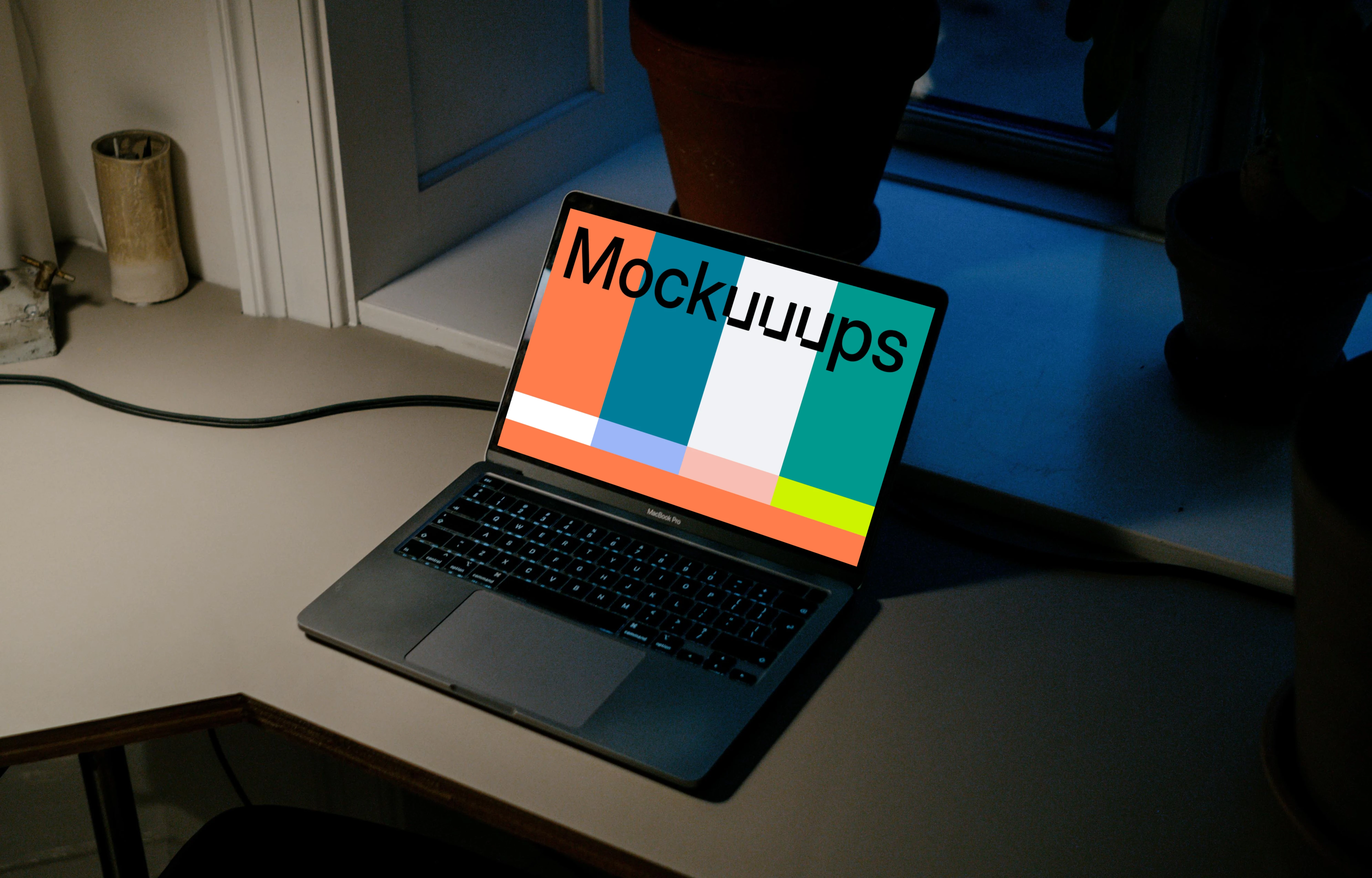 MacBook Pro mockup on a reading table