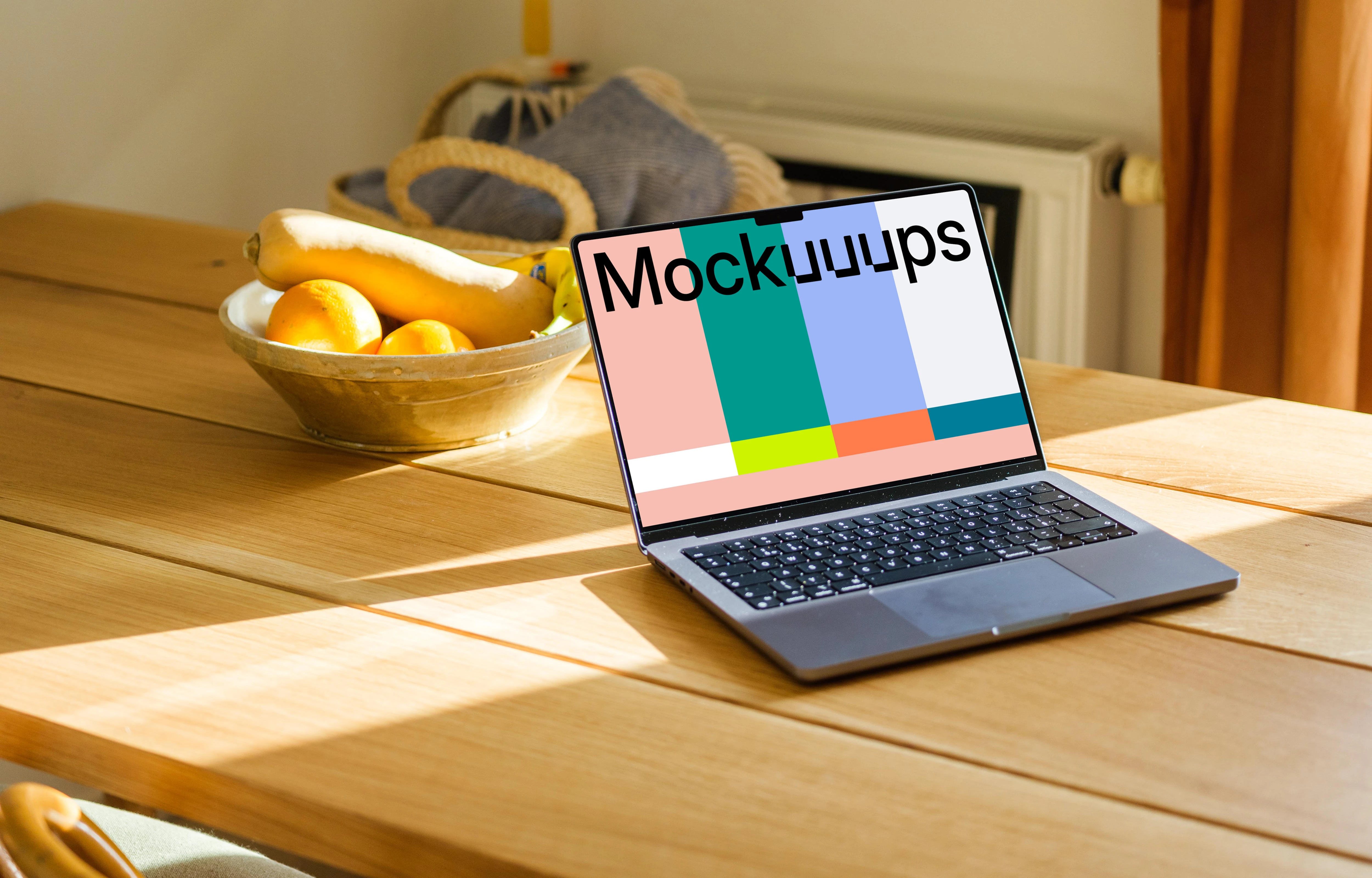 MacBook Pro mockup on a table with photo frames in the background