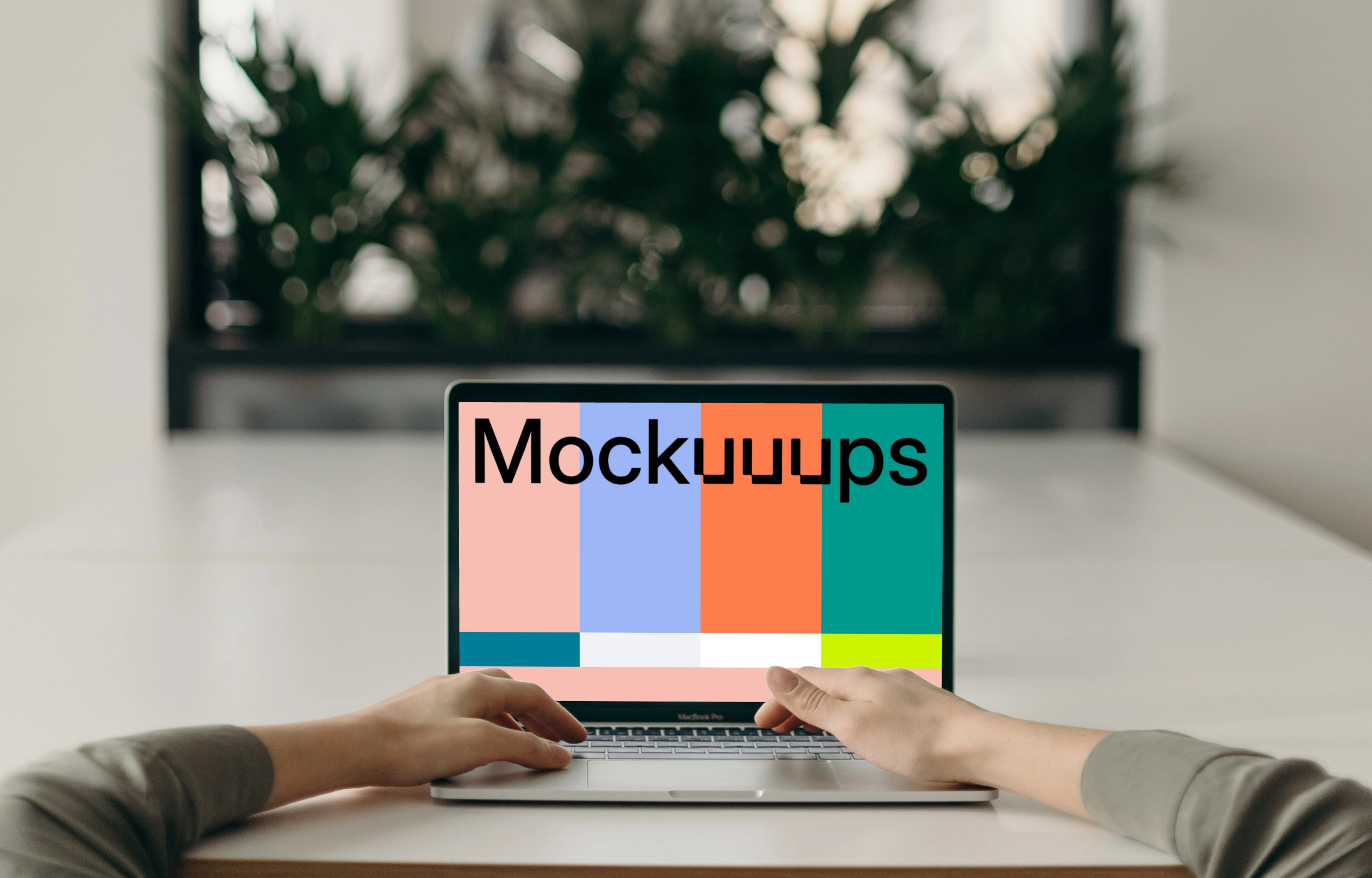 MacBook Pro mockup on a white table opposite an large mirror