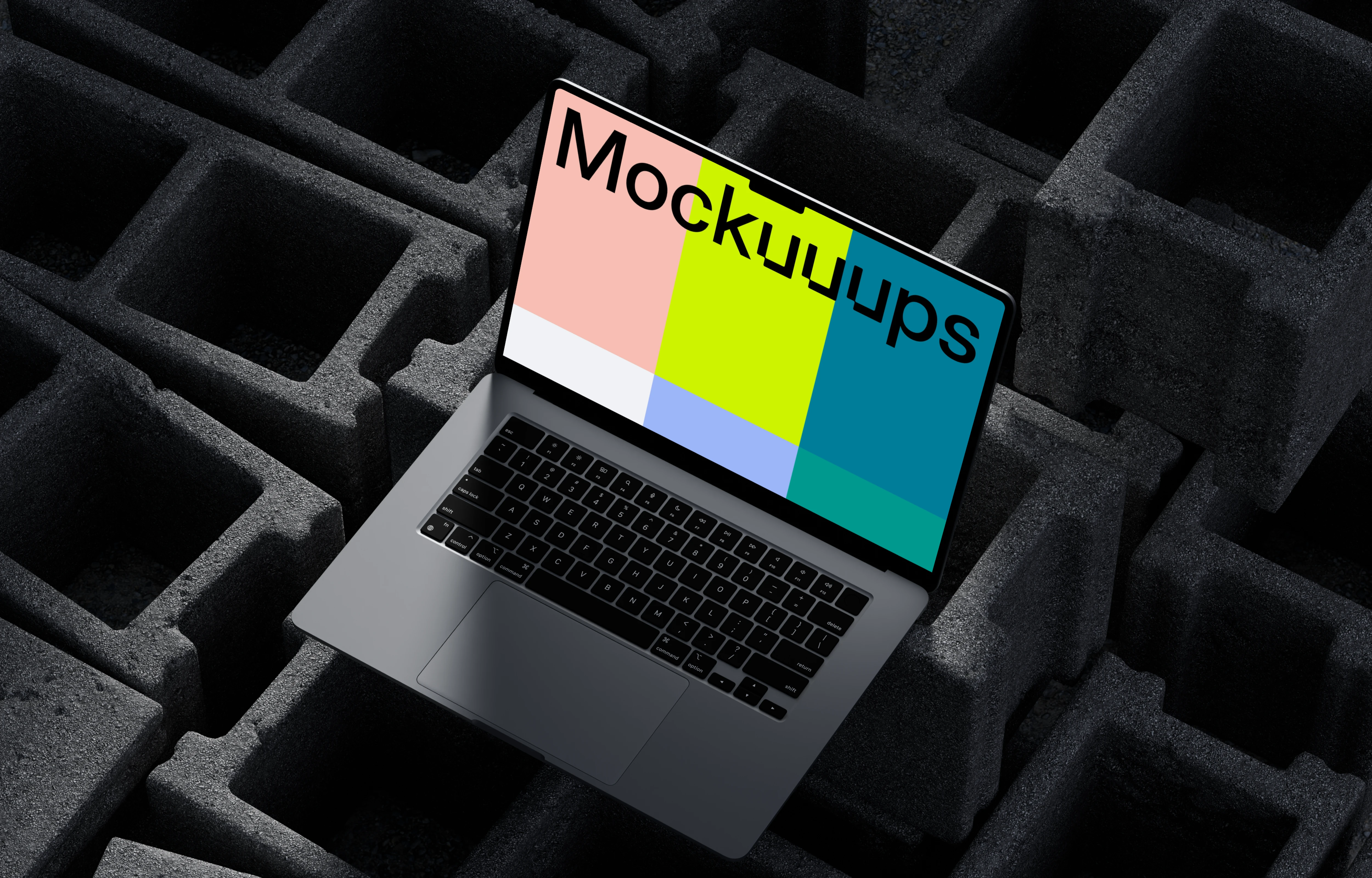 MacBook Pro mockup on textured concrete blocks