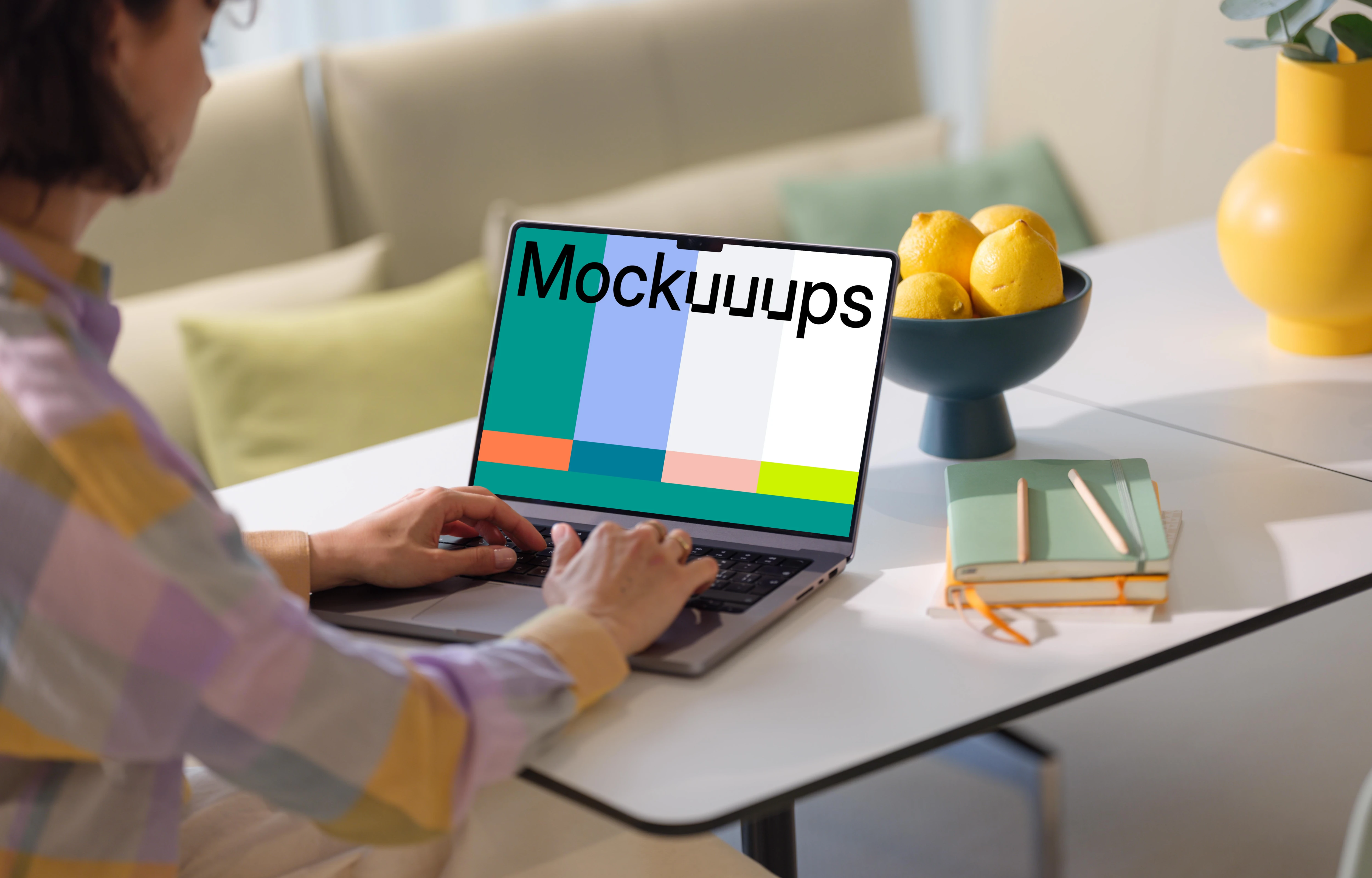 MacBook Pro mockup with woman at a modern home office