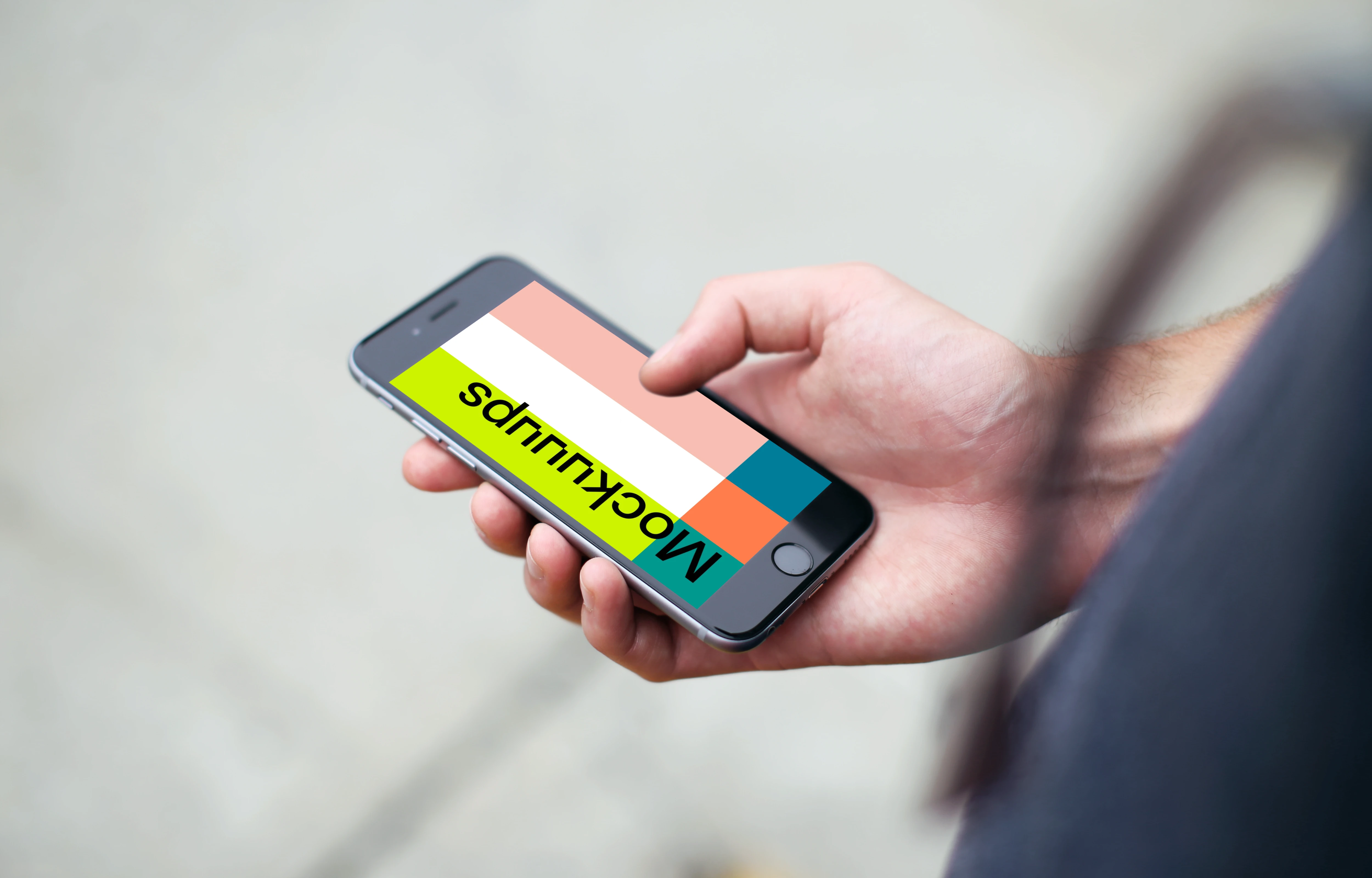 Man standing with iPhone 6s mockup on a street