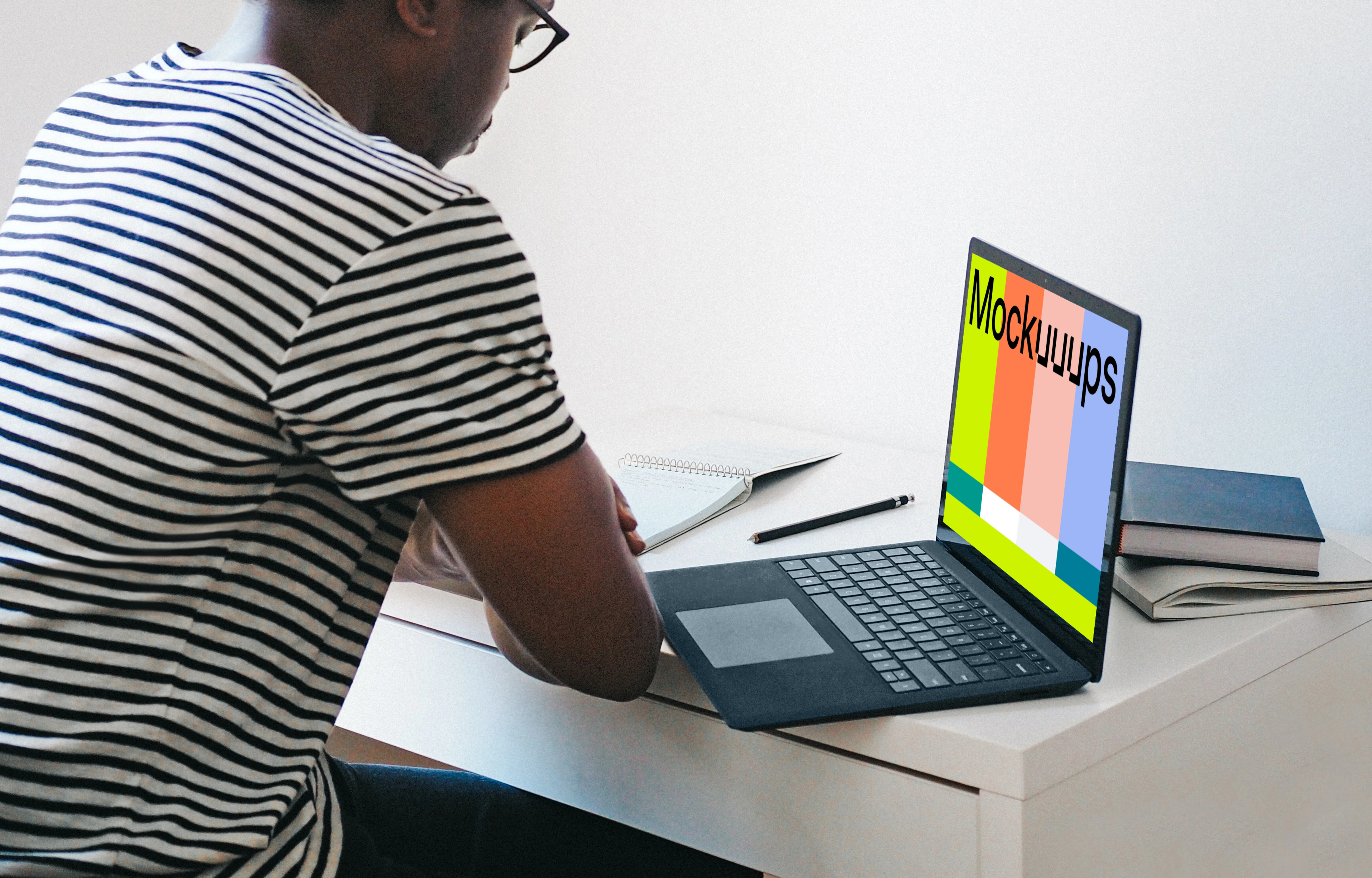 Man with Microsoft Surface Laptop mockup