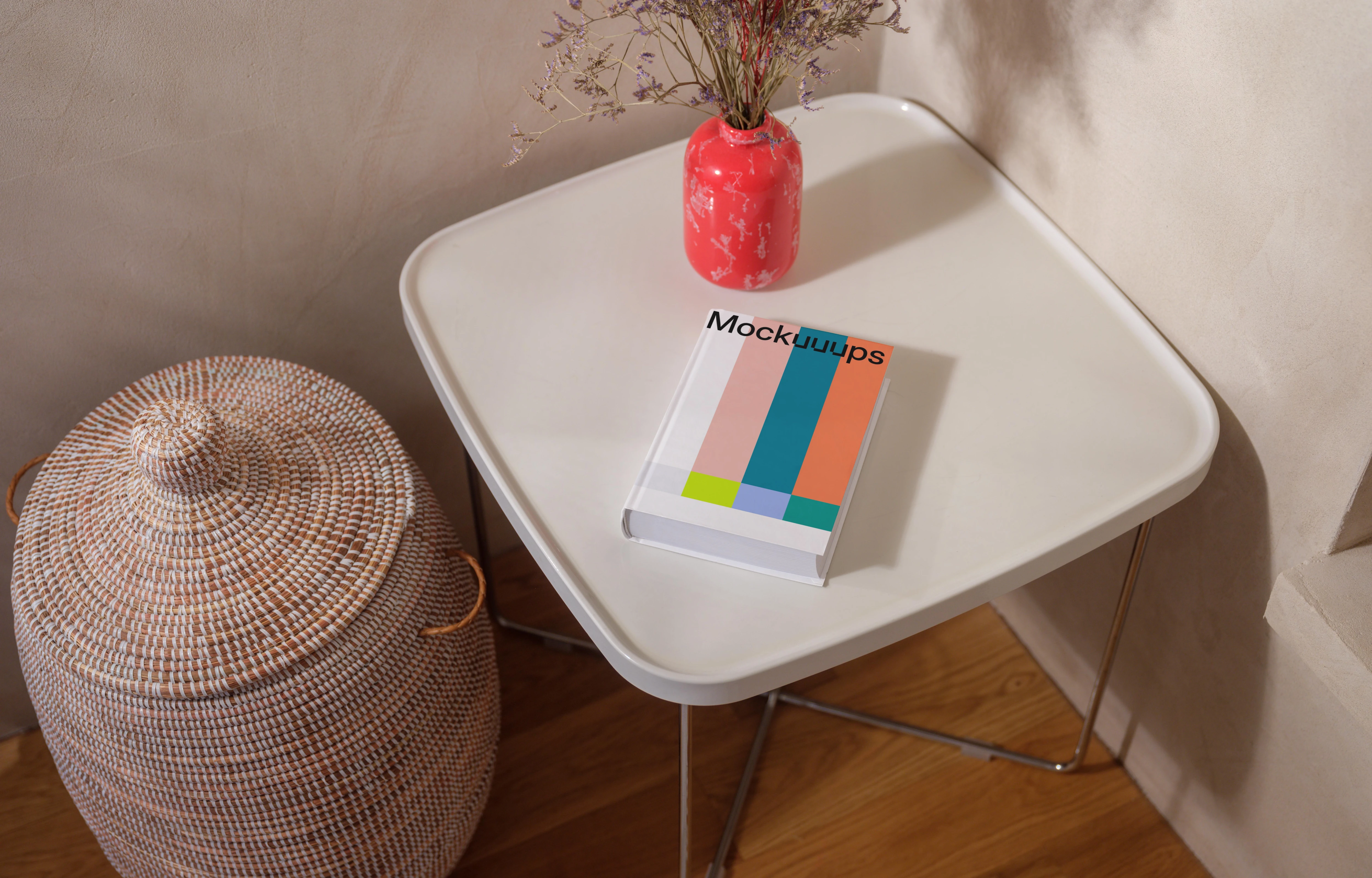 Mockup of a book on a minimalist table with decor