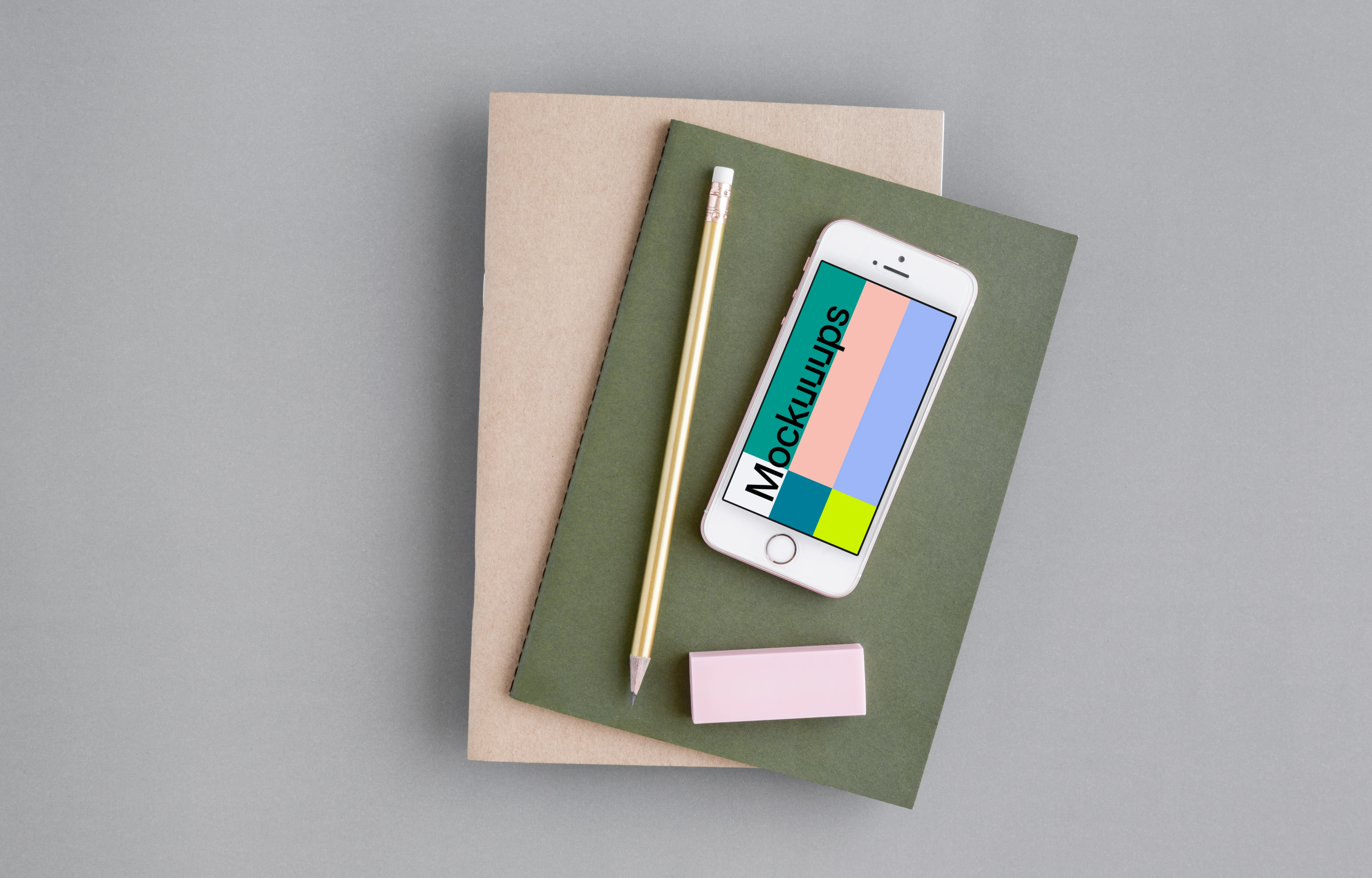 iPhone SE mockup with a green and brown journal