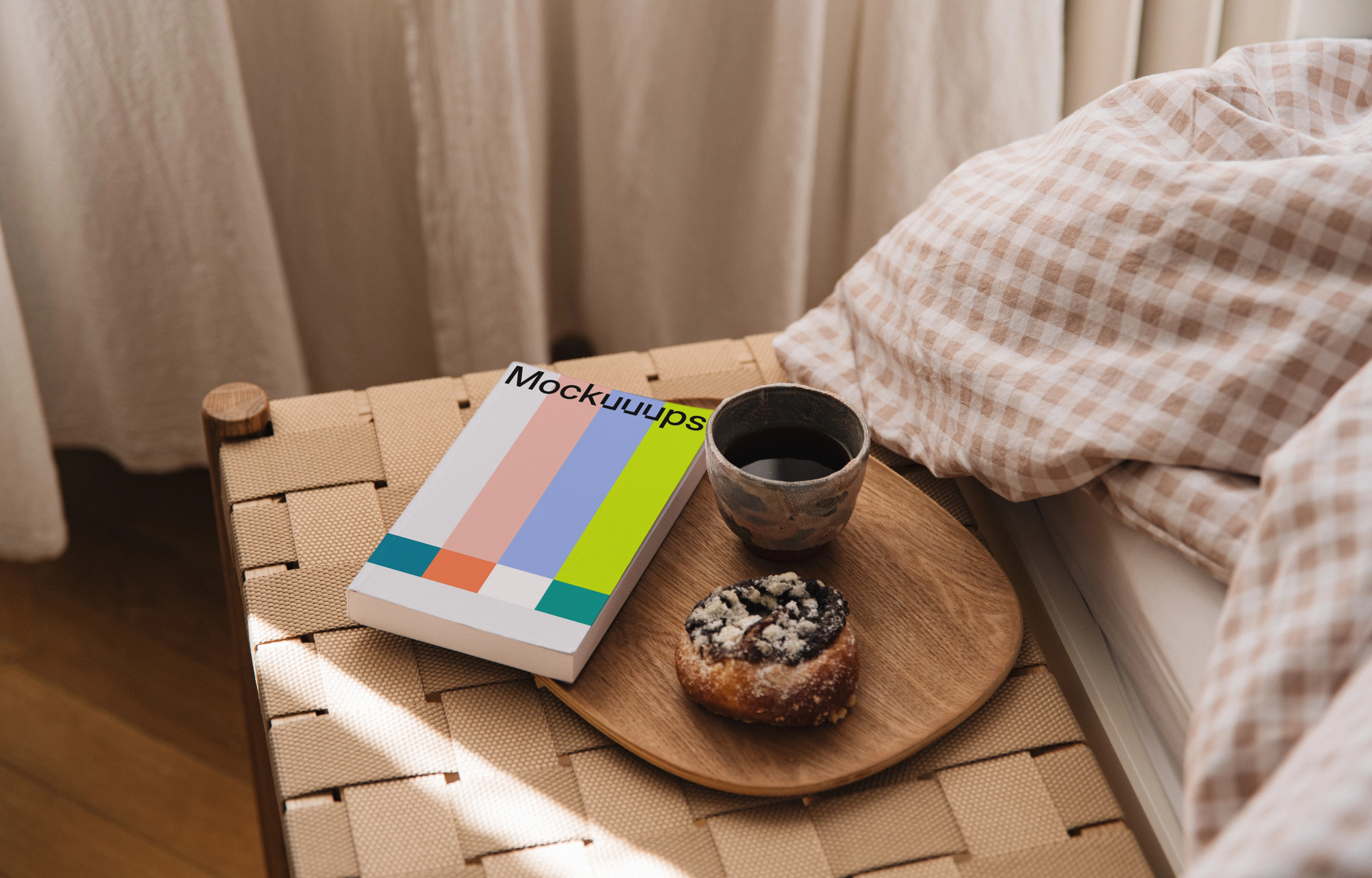Paperback book mockup on a bedside table with breakfast