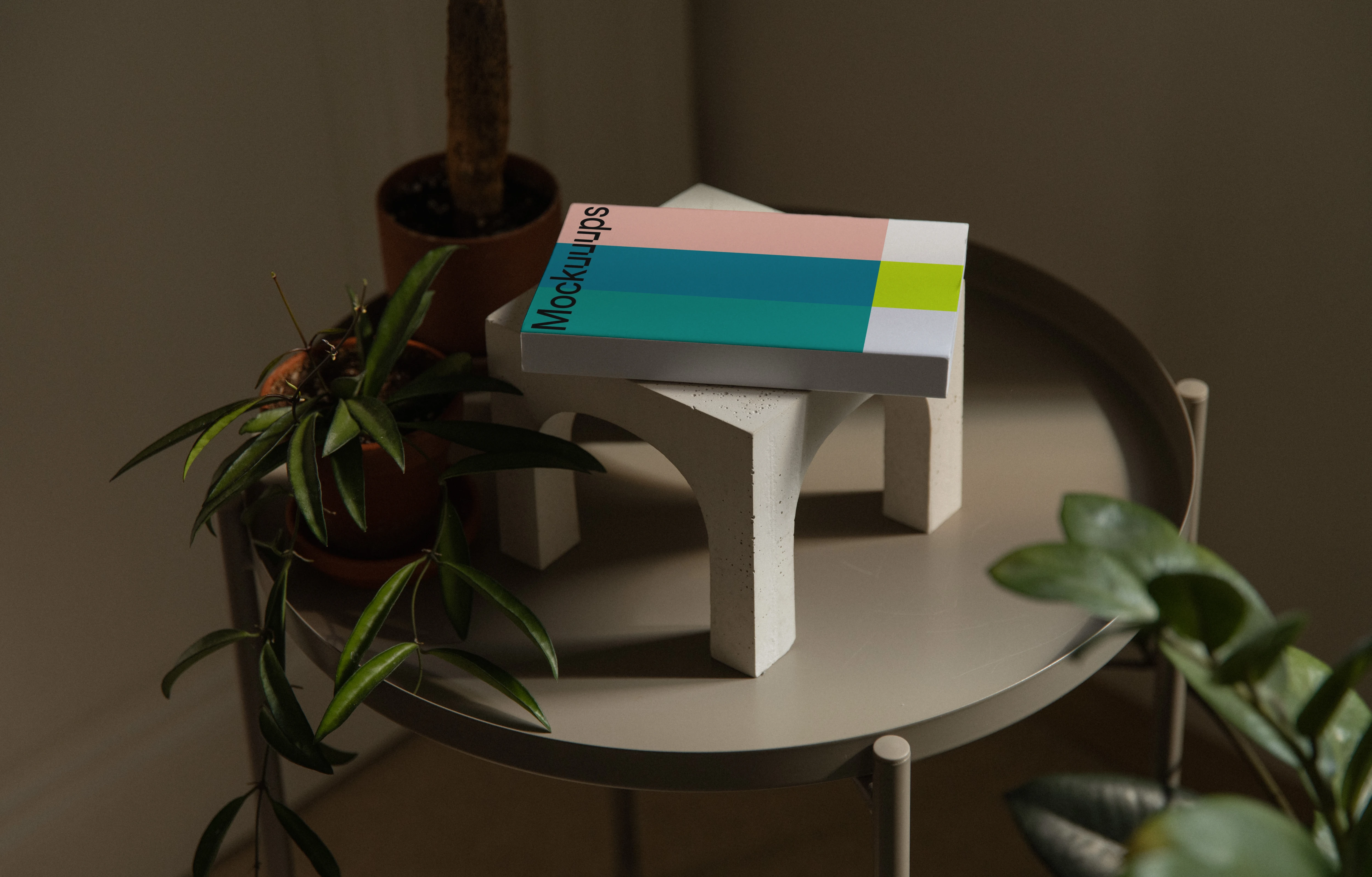 Paperback book mockup on a decorative table
