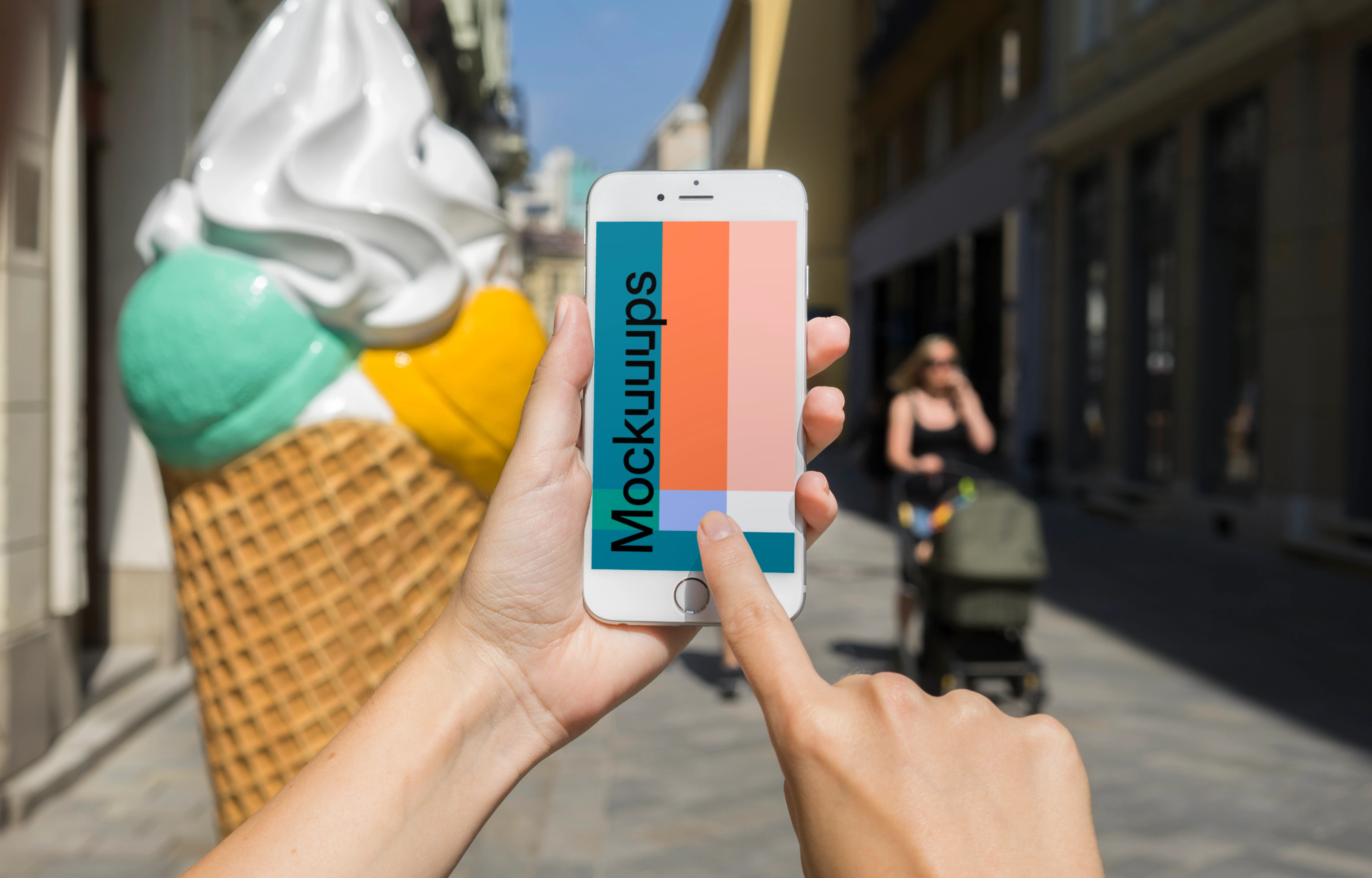 Pointing on iPhone 6 mockup in front of ice cream shop