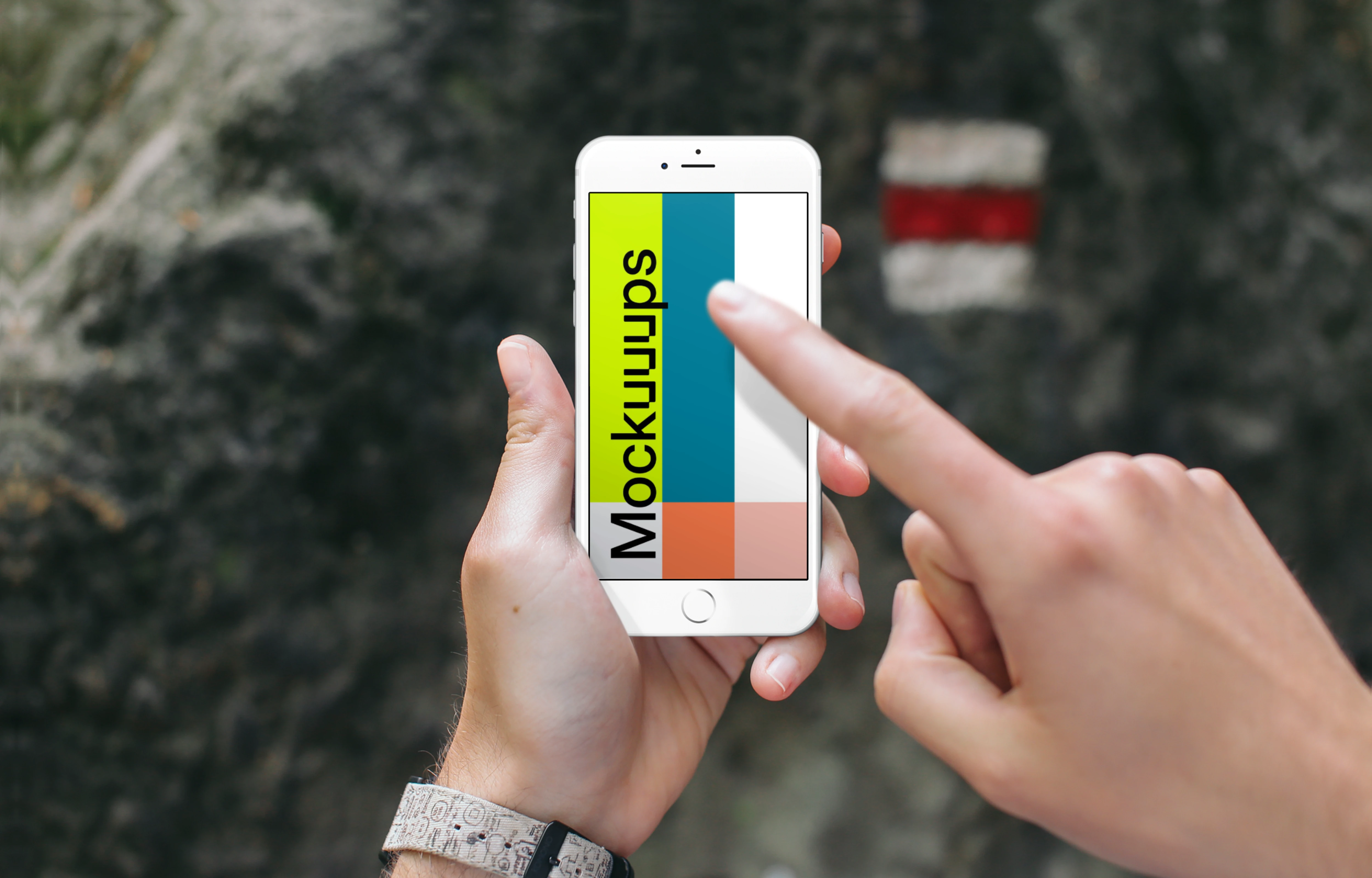 Pointing on iPhone 6s mockup in front of a Tourist Sign