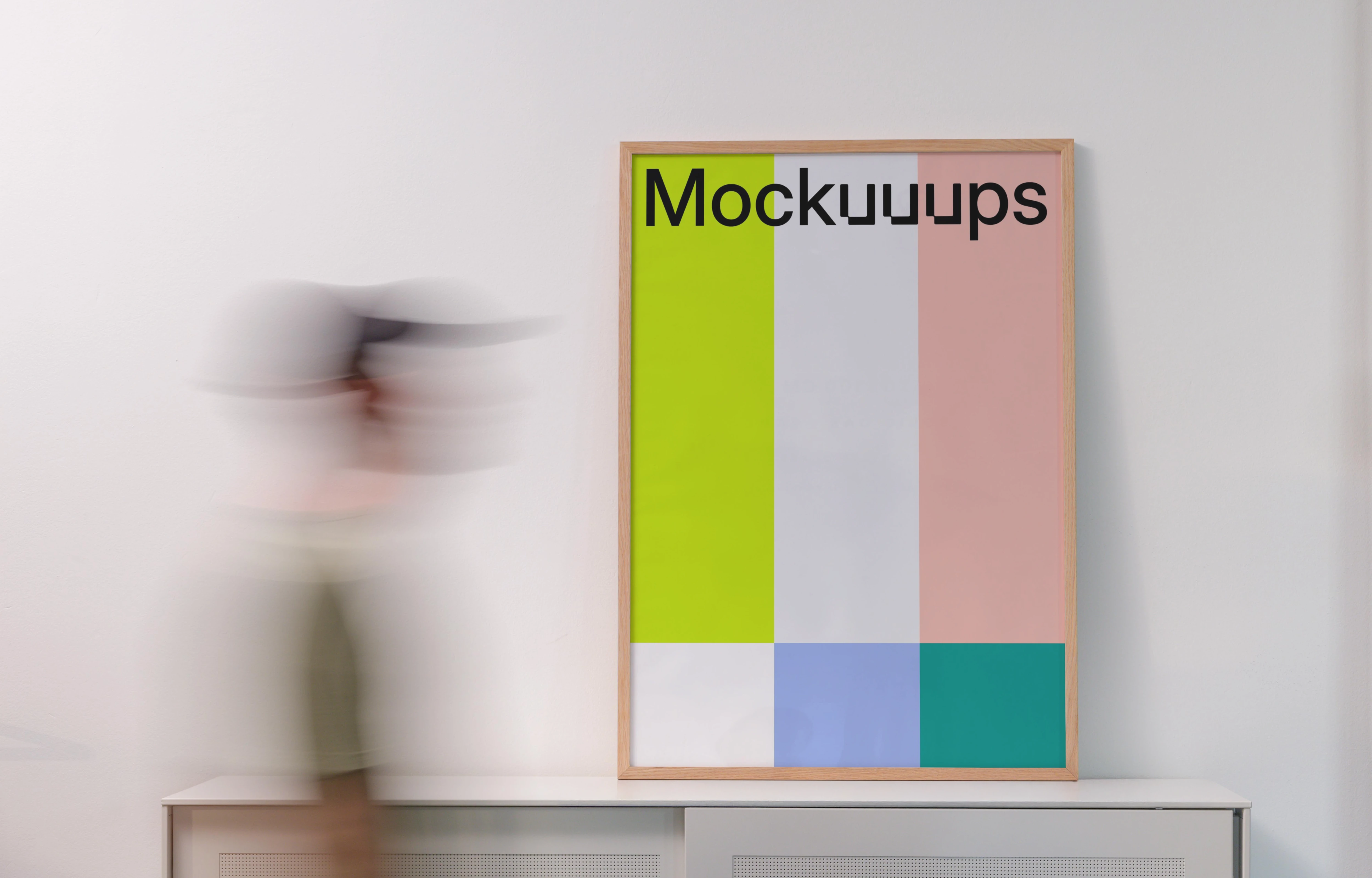 Poster mockup above a minimalist office cabinet