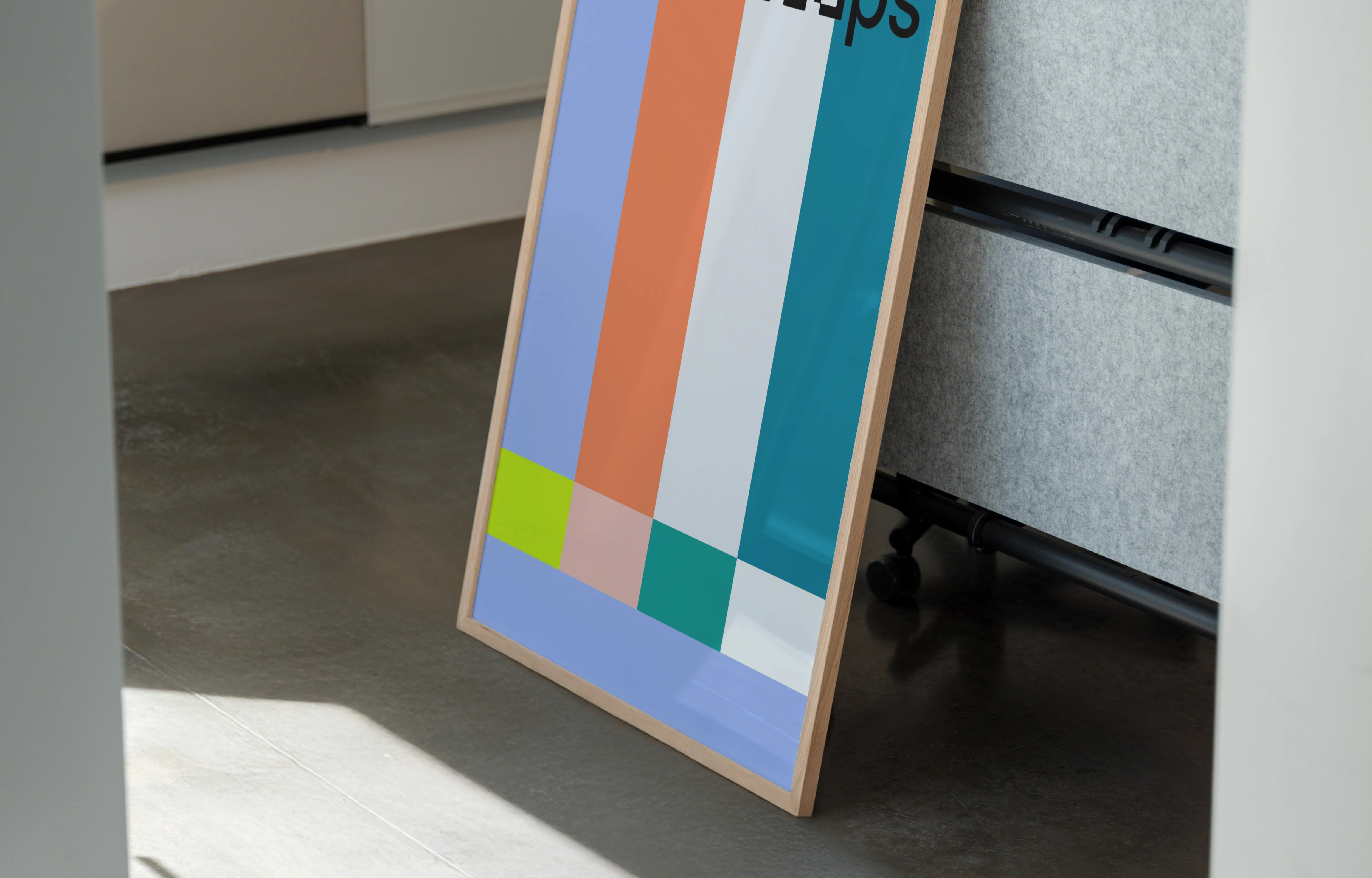 Poster mockup leaning against an office partition