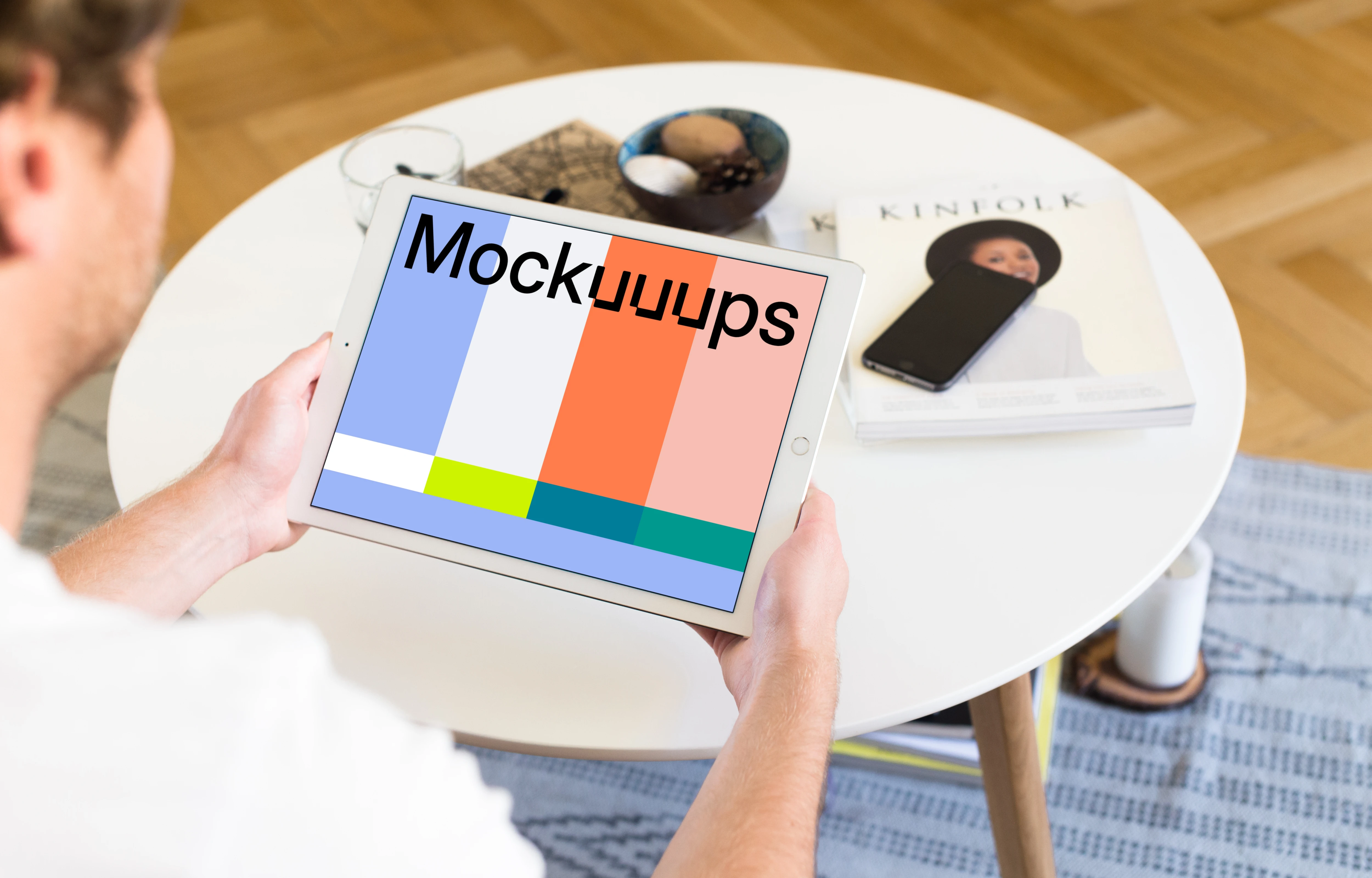 Sitting on couch and holding iPad Pro mockup