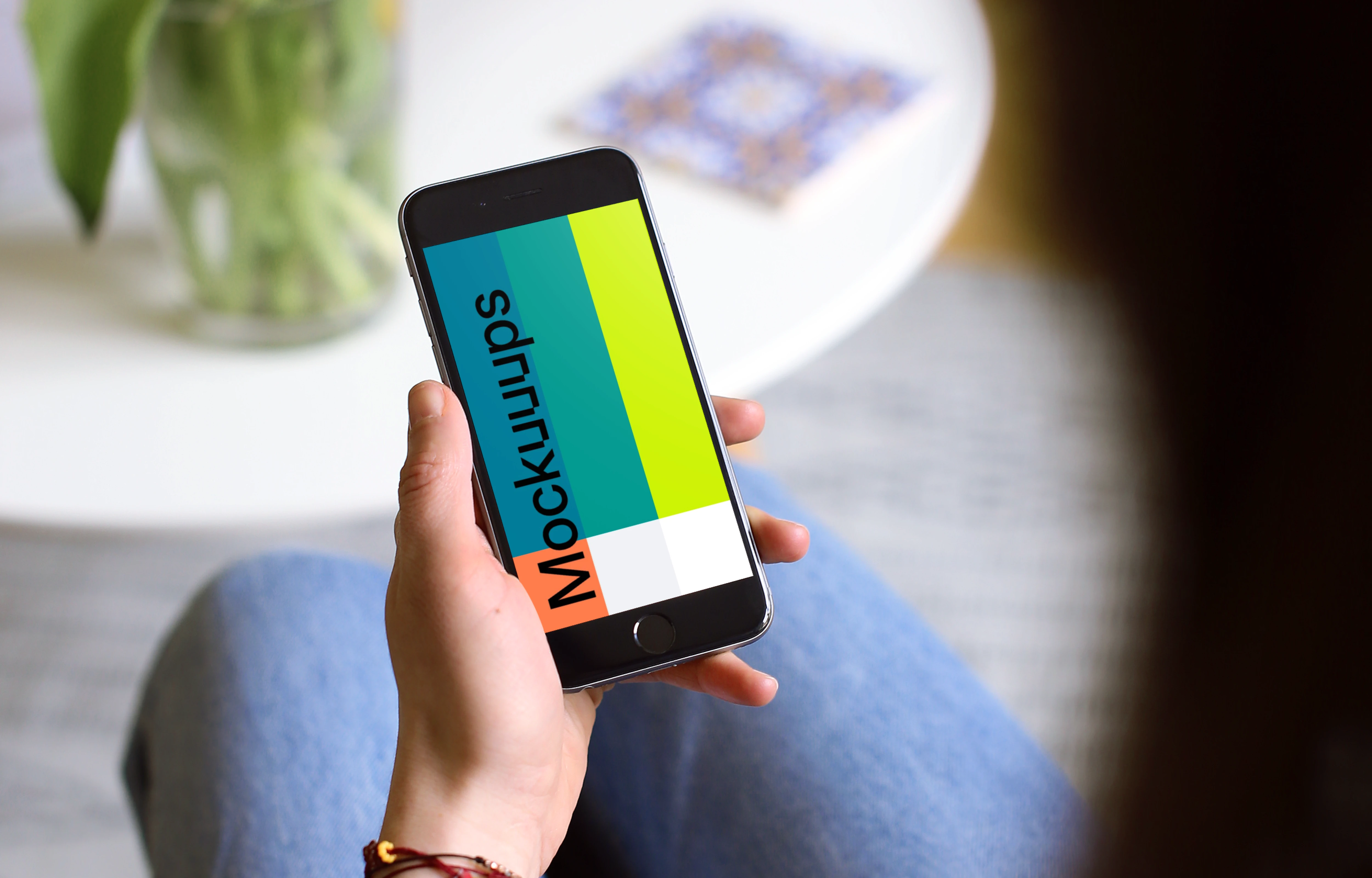 Sitting on the couch with iPhone 6s mockup