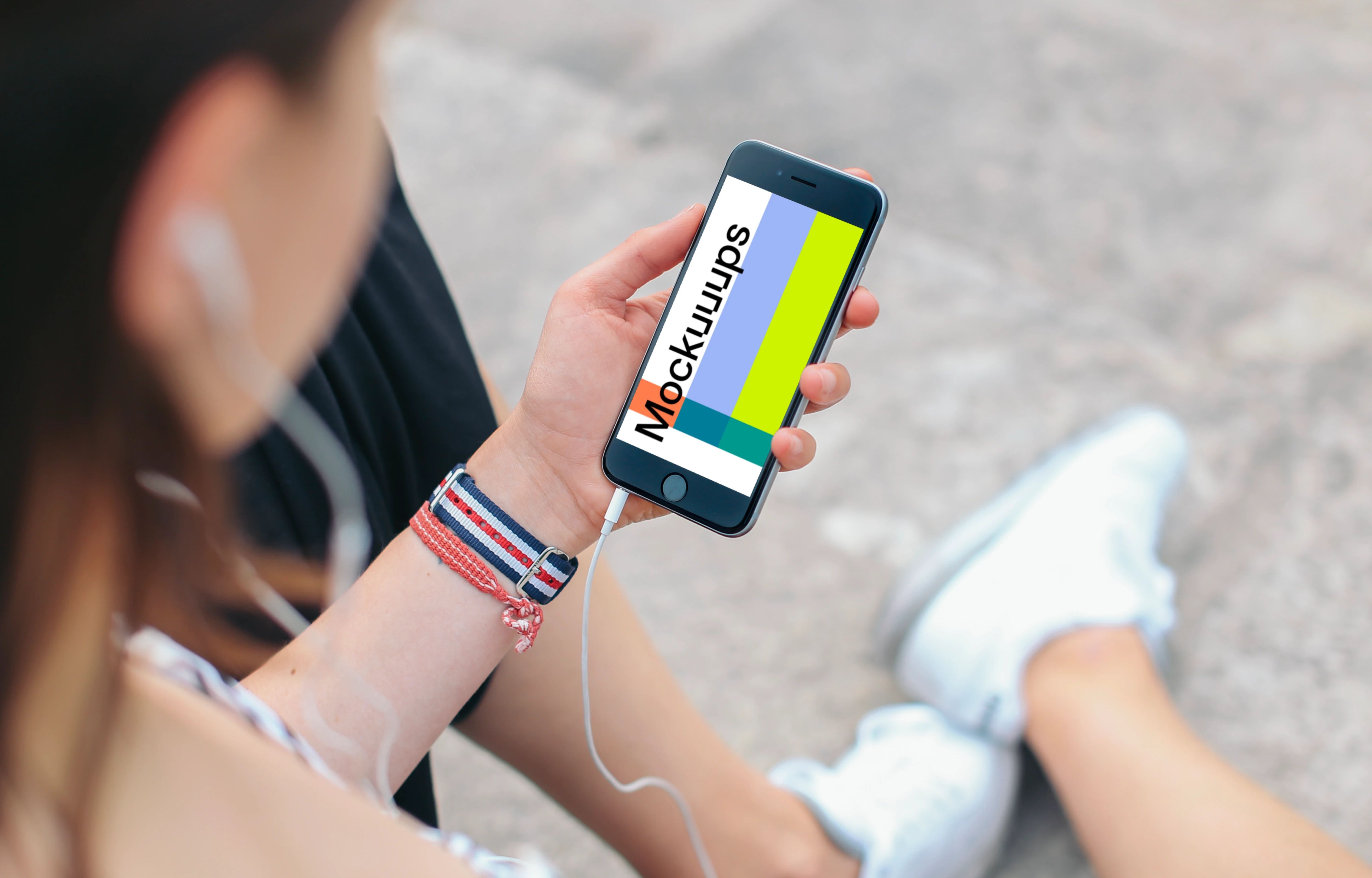 Sitting with iPhone 6 mockup and Headphones