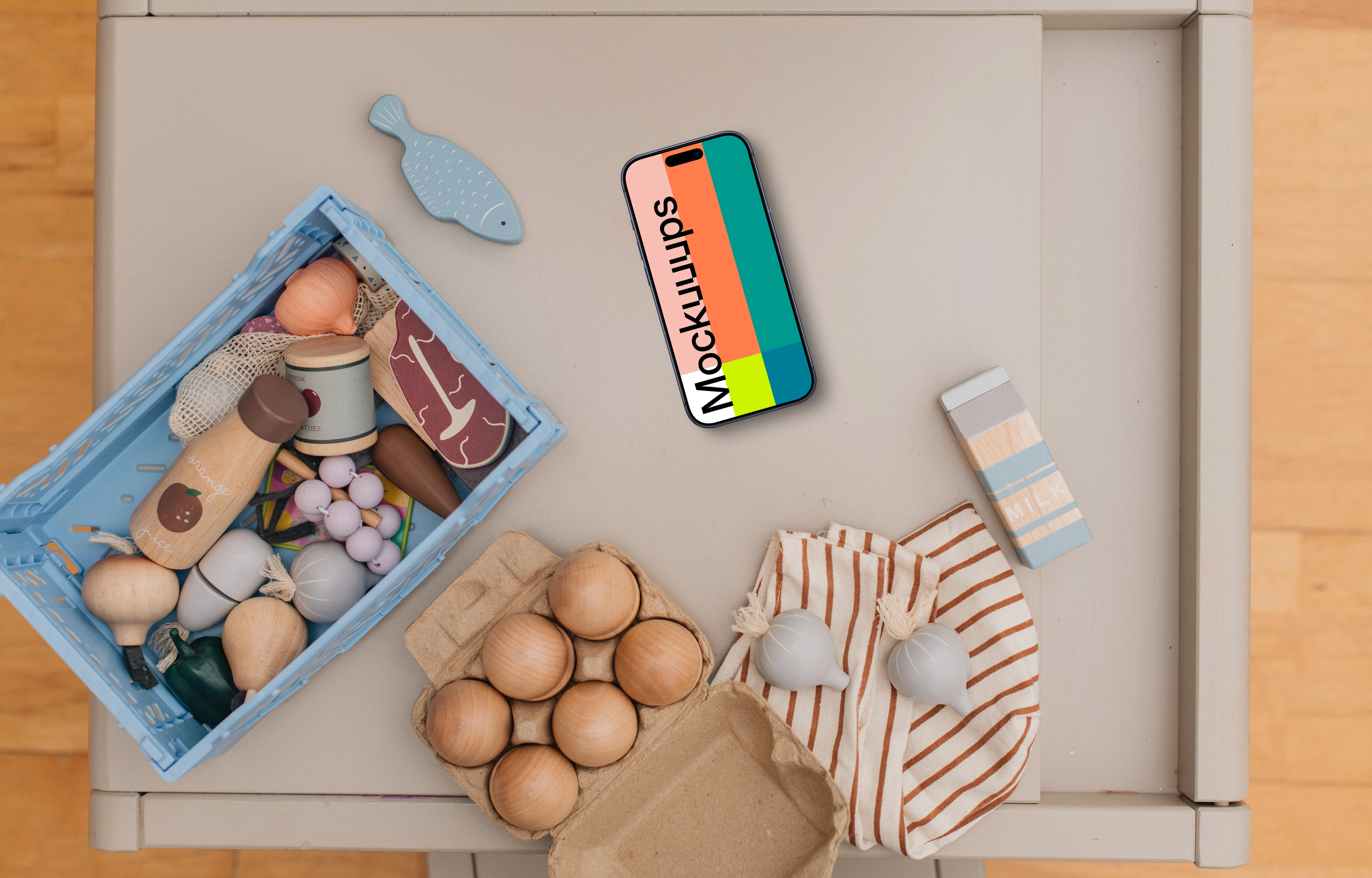 Smartphone mockup among children's toys