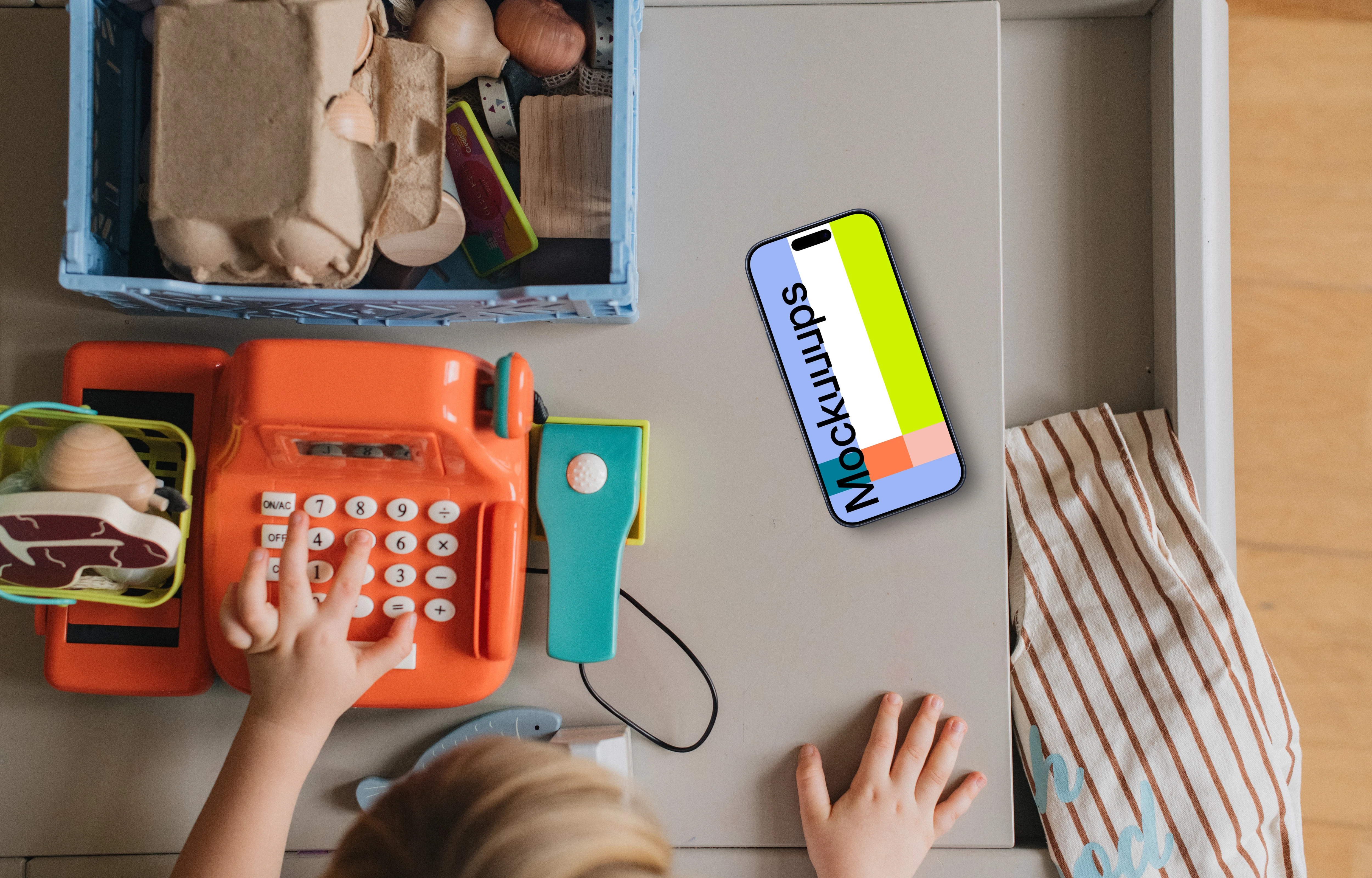 Smartphone mockup beside children's play area
