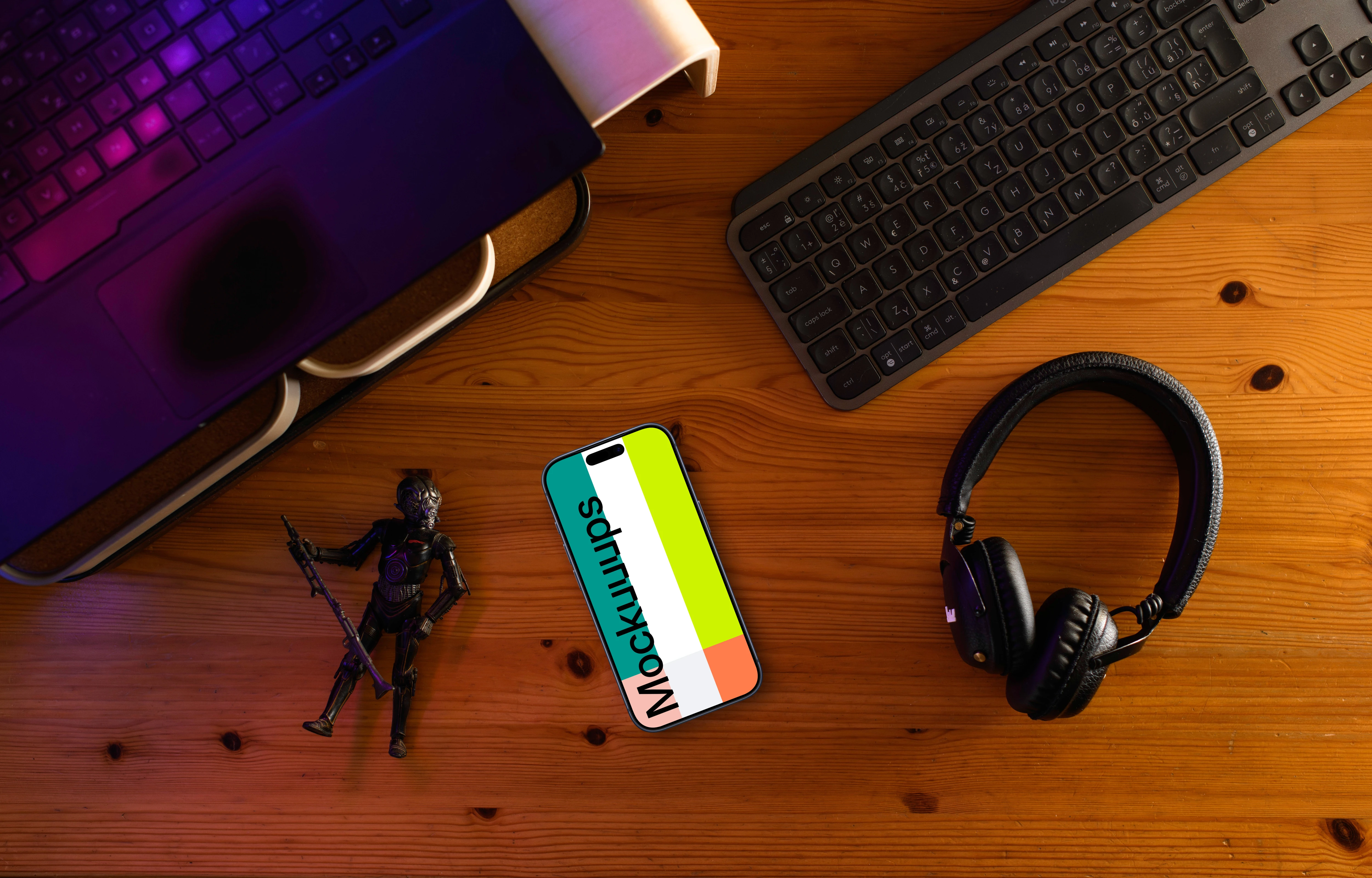 Smartphone mockup on a gamer's desk with action figure