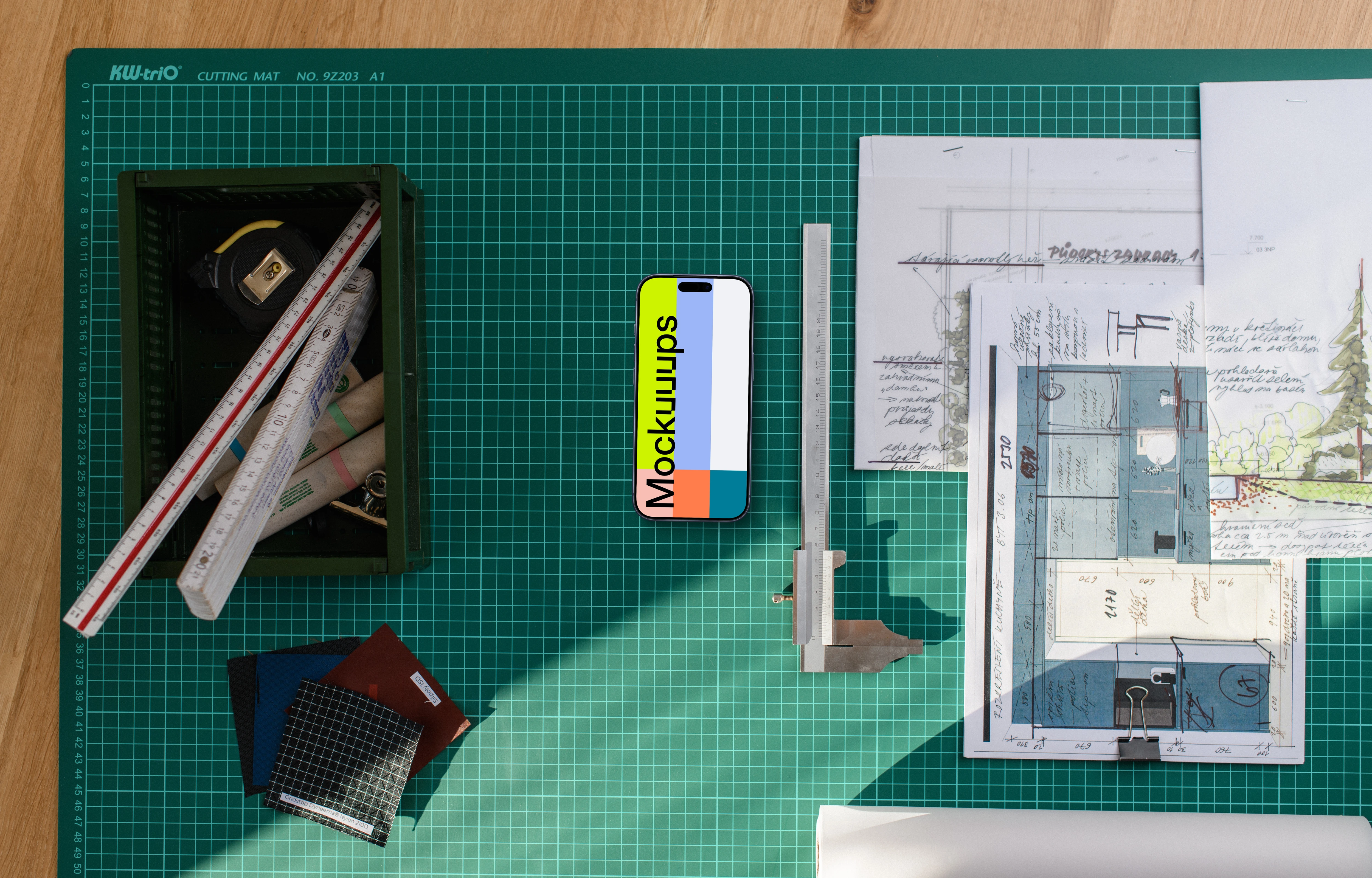 Smartphone mockup with architectural plans and tools