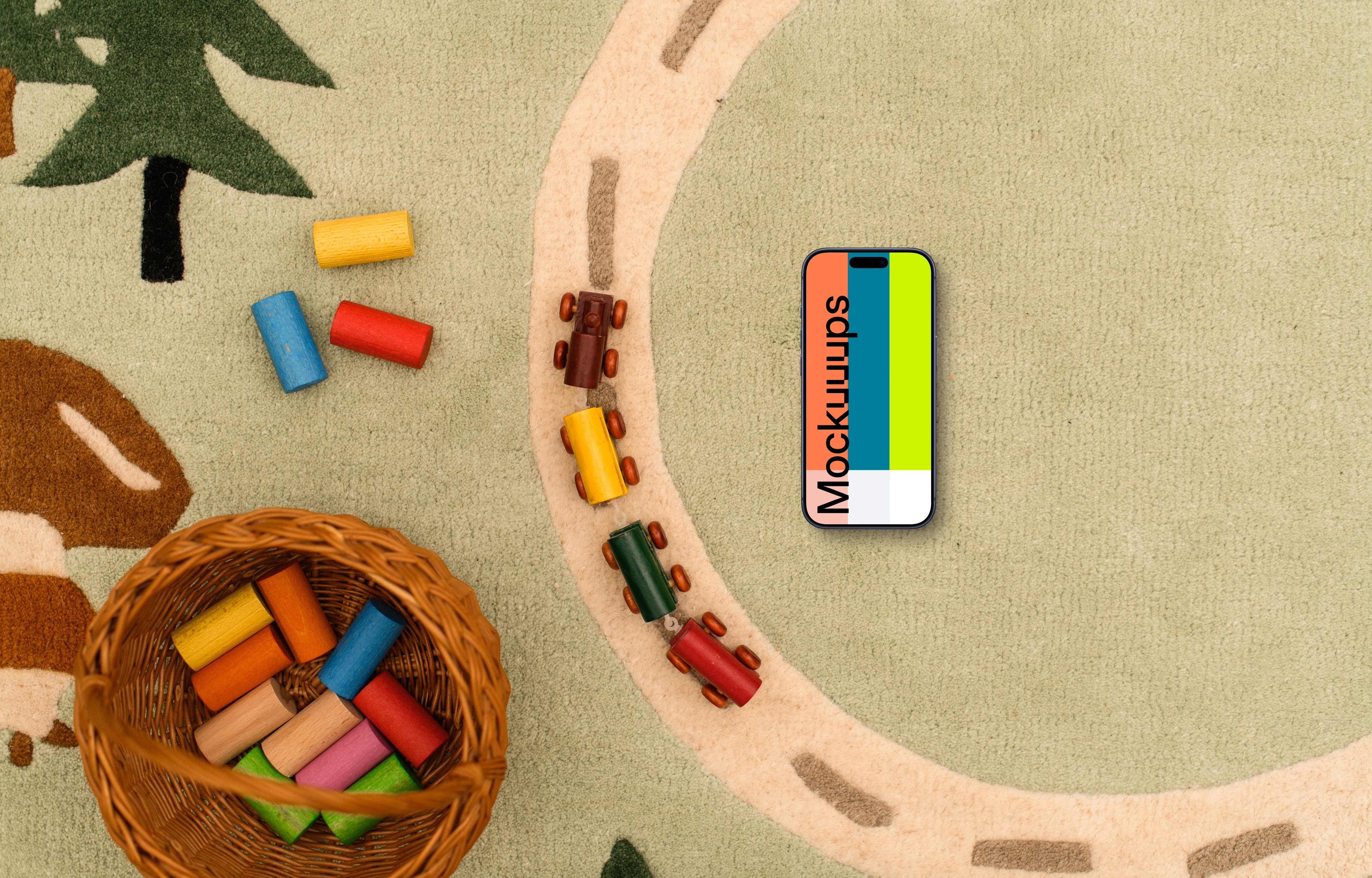 Smartphone mockup with colorful toy blocks on a child-themed rug