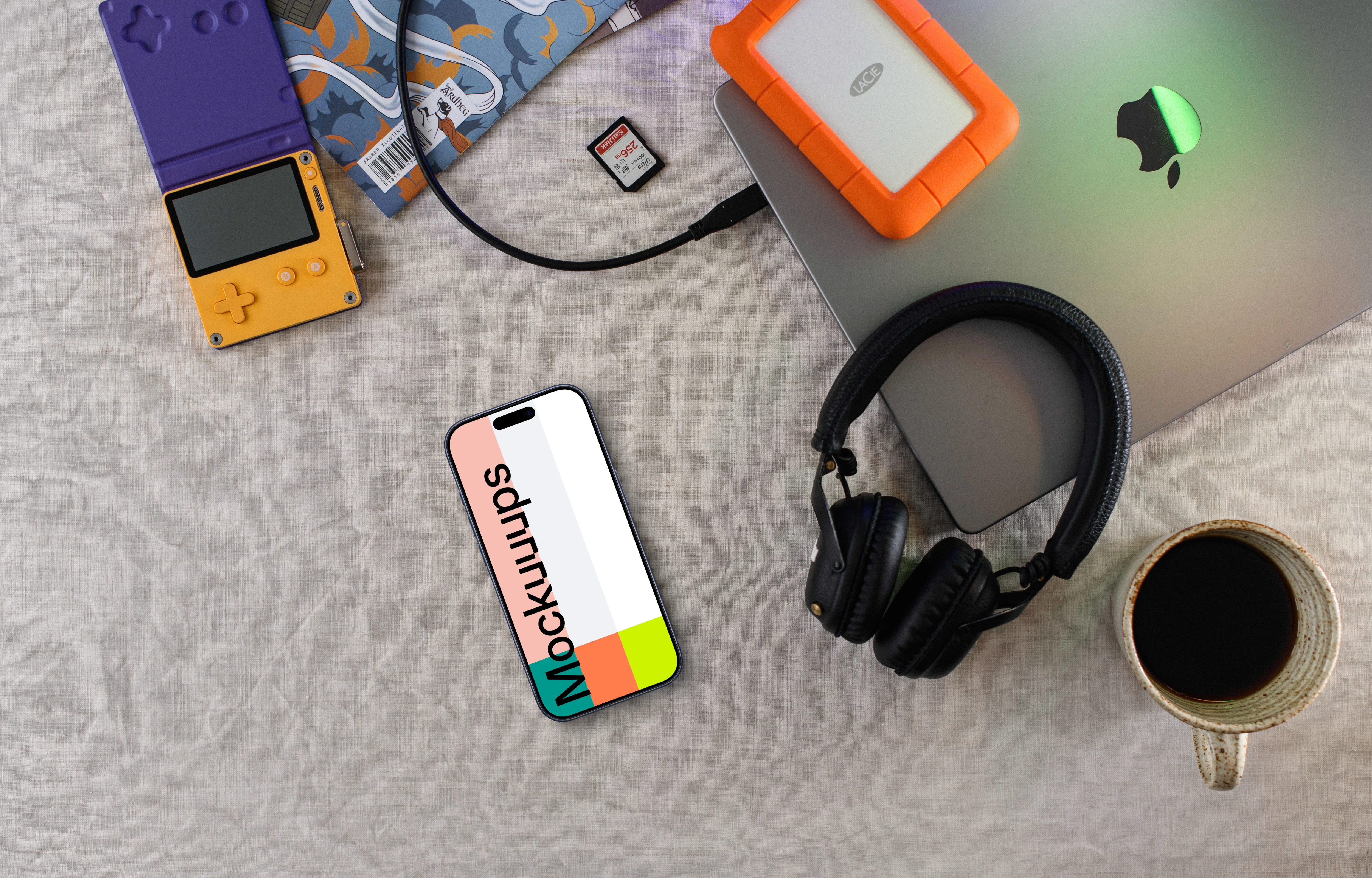 Smartphone mockup with tech gadgets and coffee