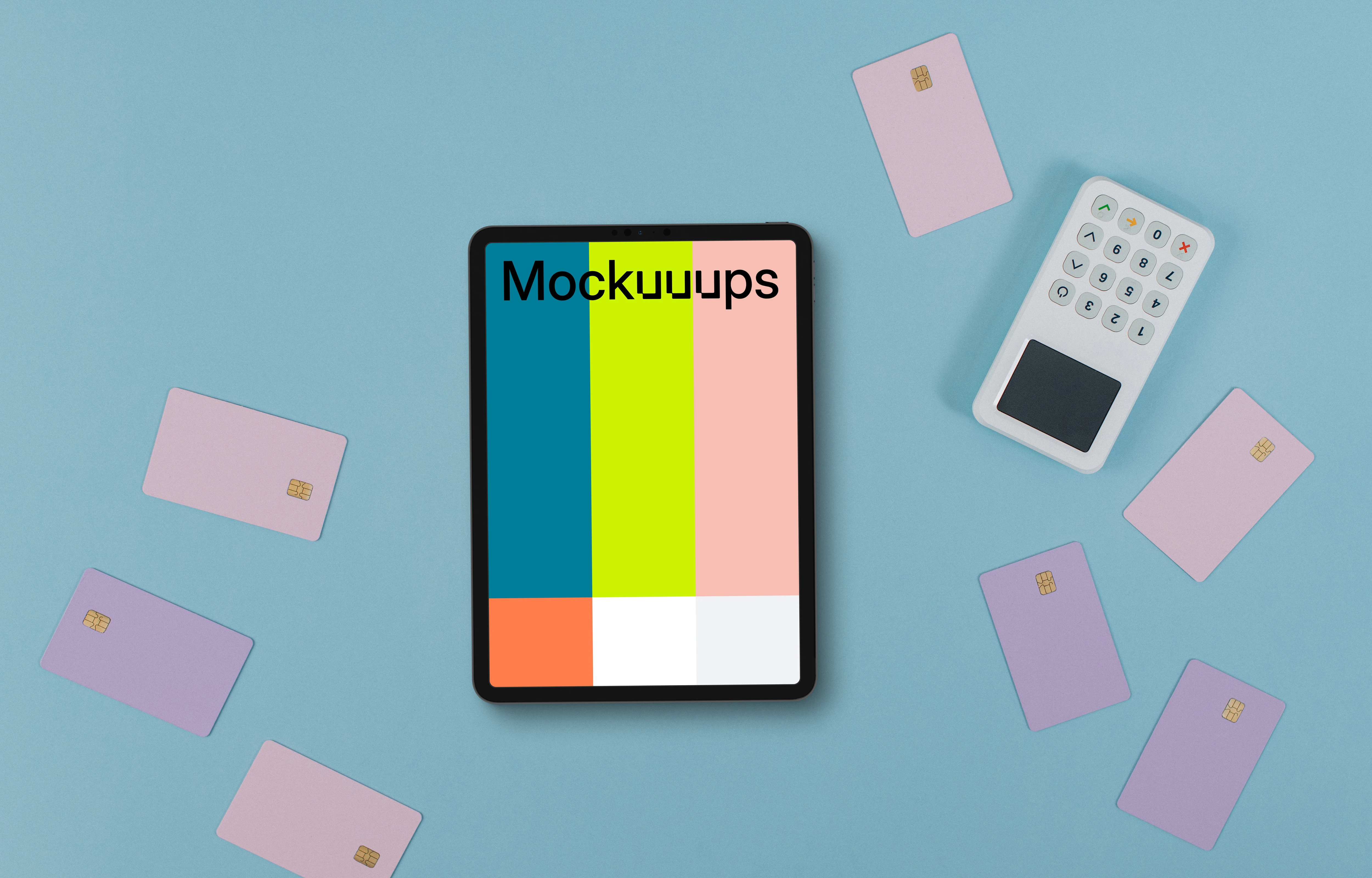 Tablet mockup surrounded by credit card and payment terminal