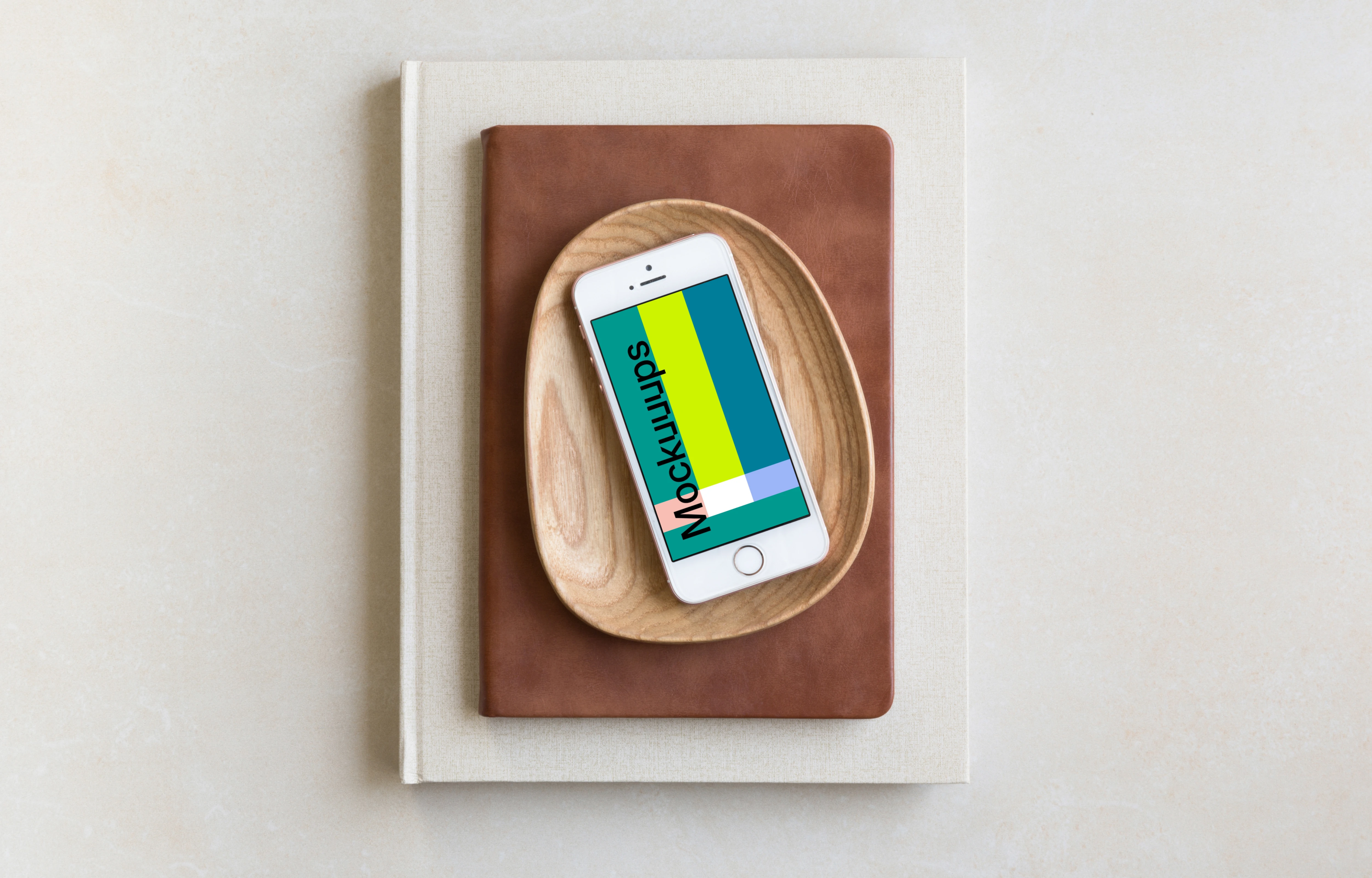 iPhone SE mockup placed on wooden plate