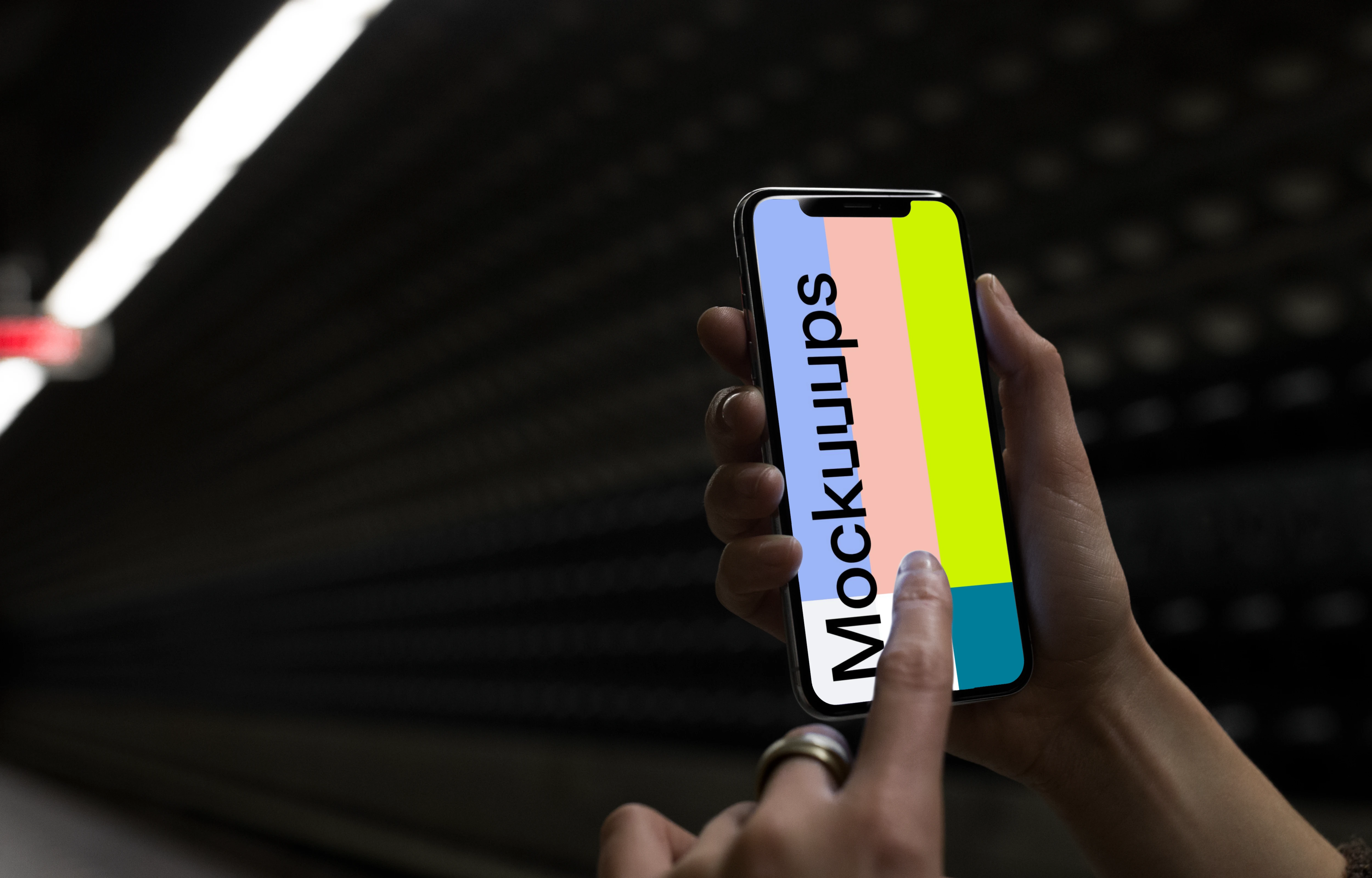 Woman with iPhone X mockup in underground station