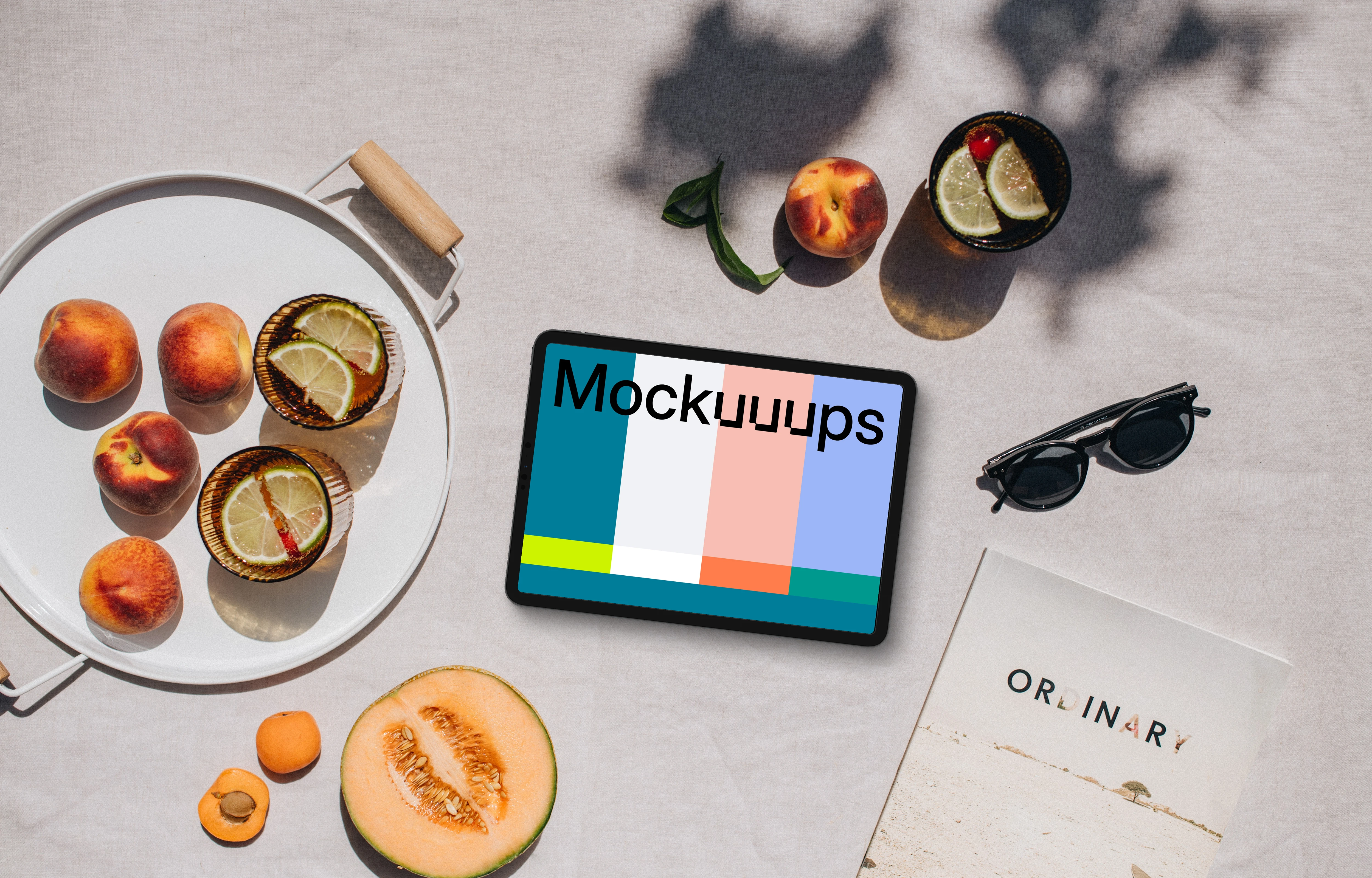 Top view of landscape tablet mockup with a magazine on the side