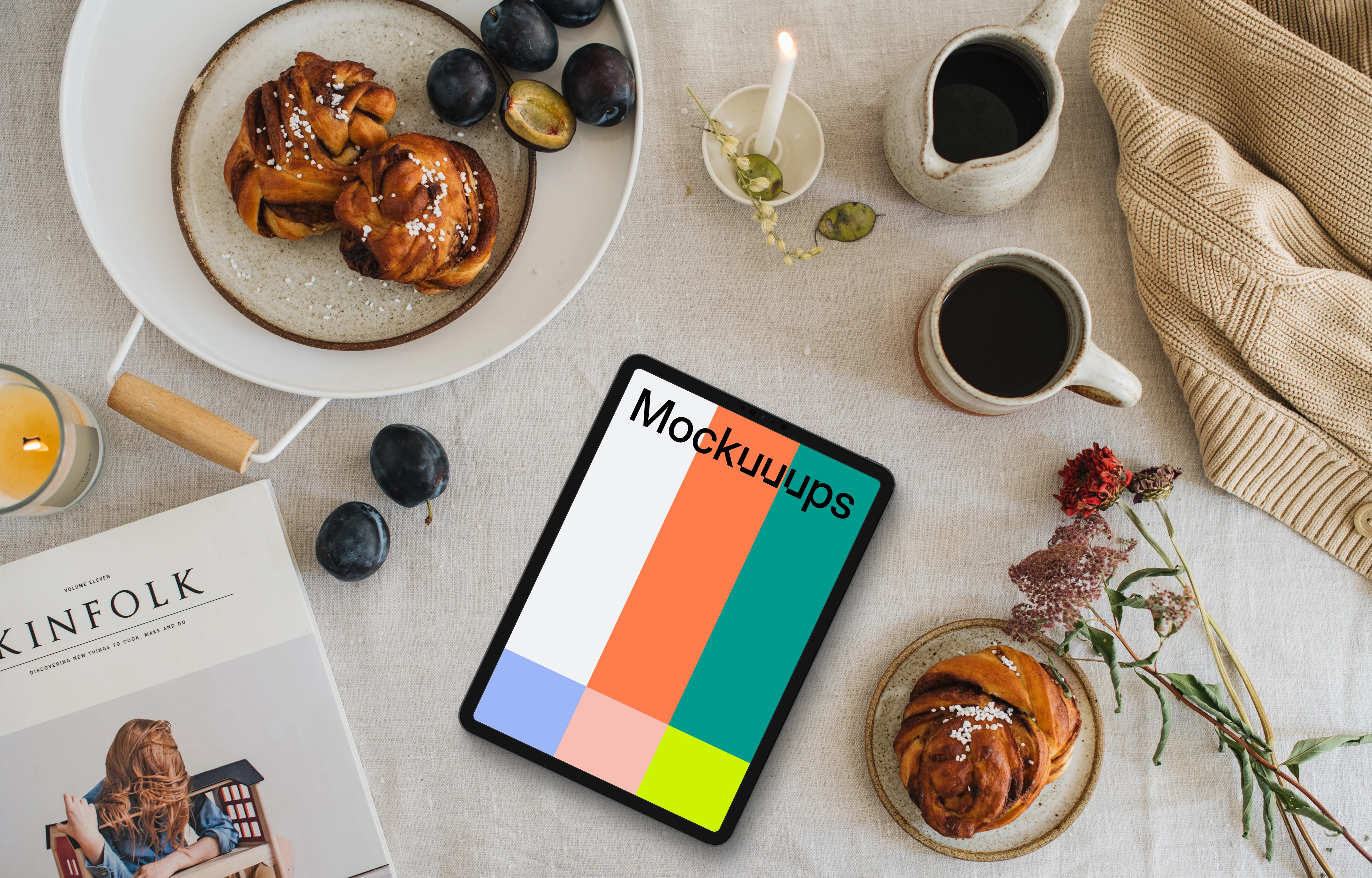 Top view of tablet mockup next to the magazine