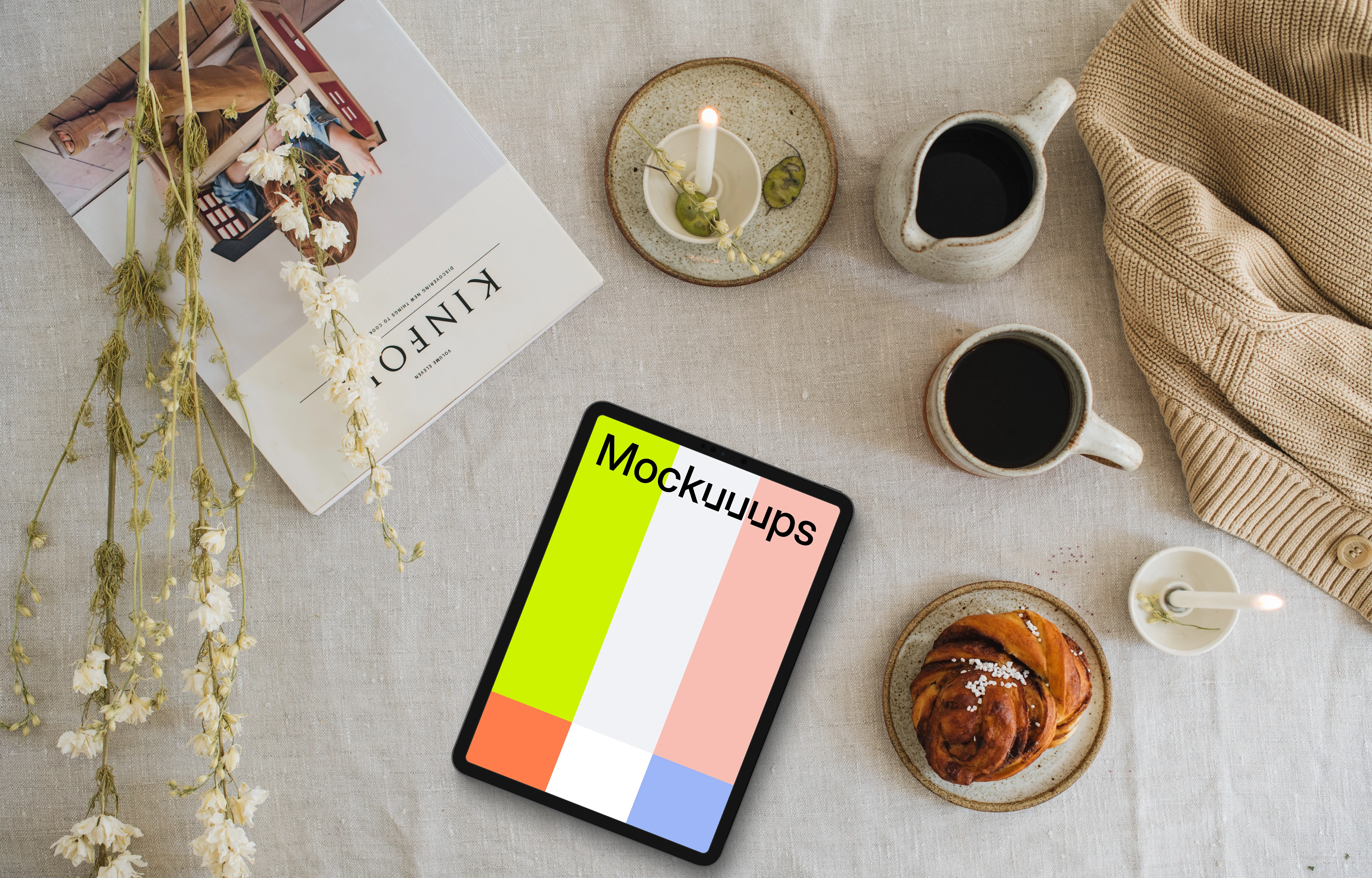 Top view of tablet mockup with a magazine on the side